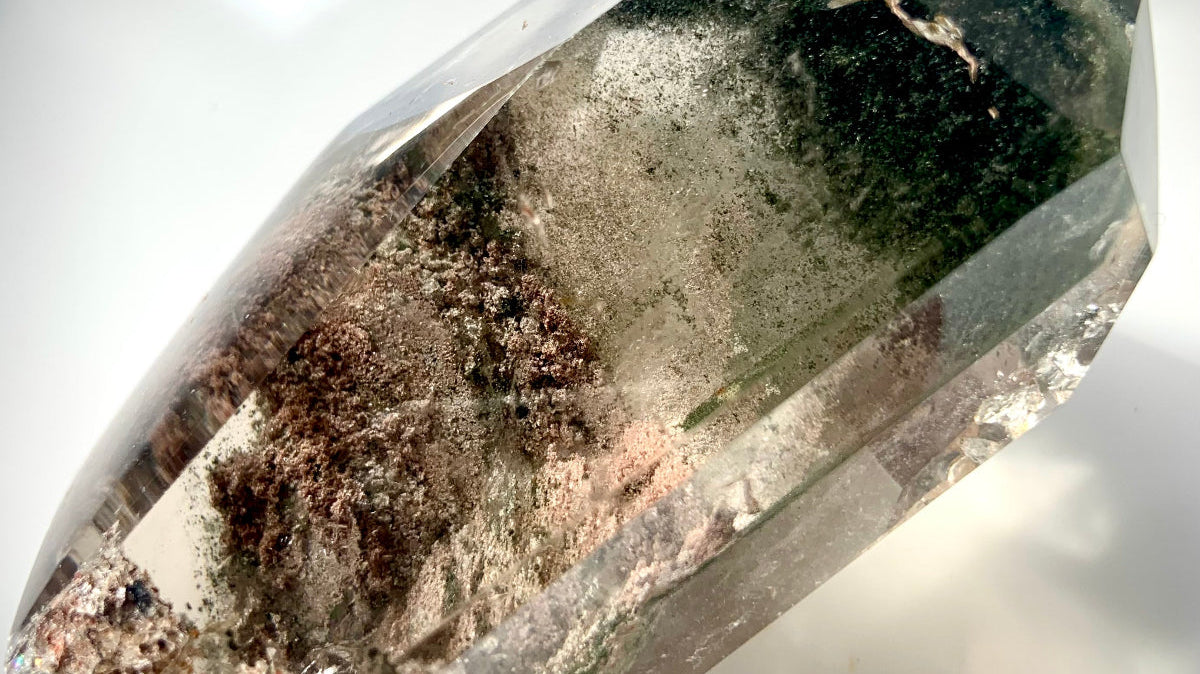 Garden Quartz crystal with scenic lodolite inclusions, showing natural mineral landscapes inside clear quartz