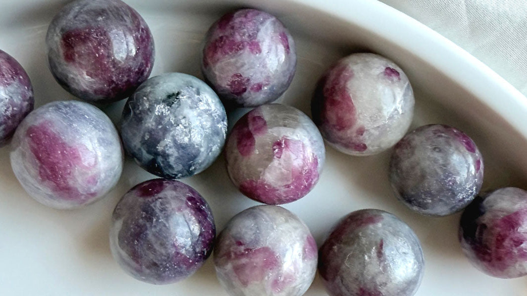 Unicorn Stone crystal spheres with pink tourmaline, lepidolite, smoky quartz & cleavelandite inclusions