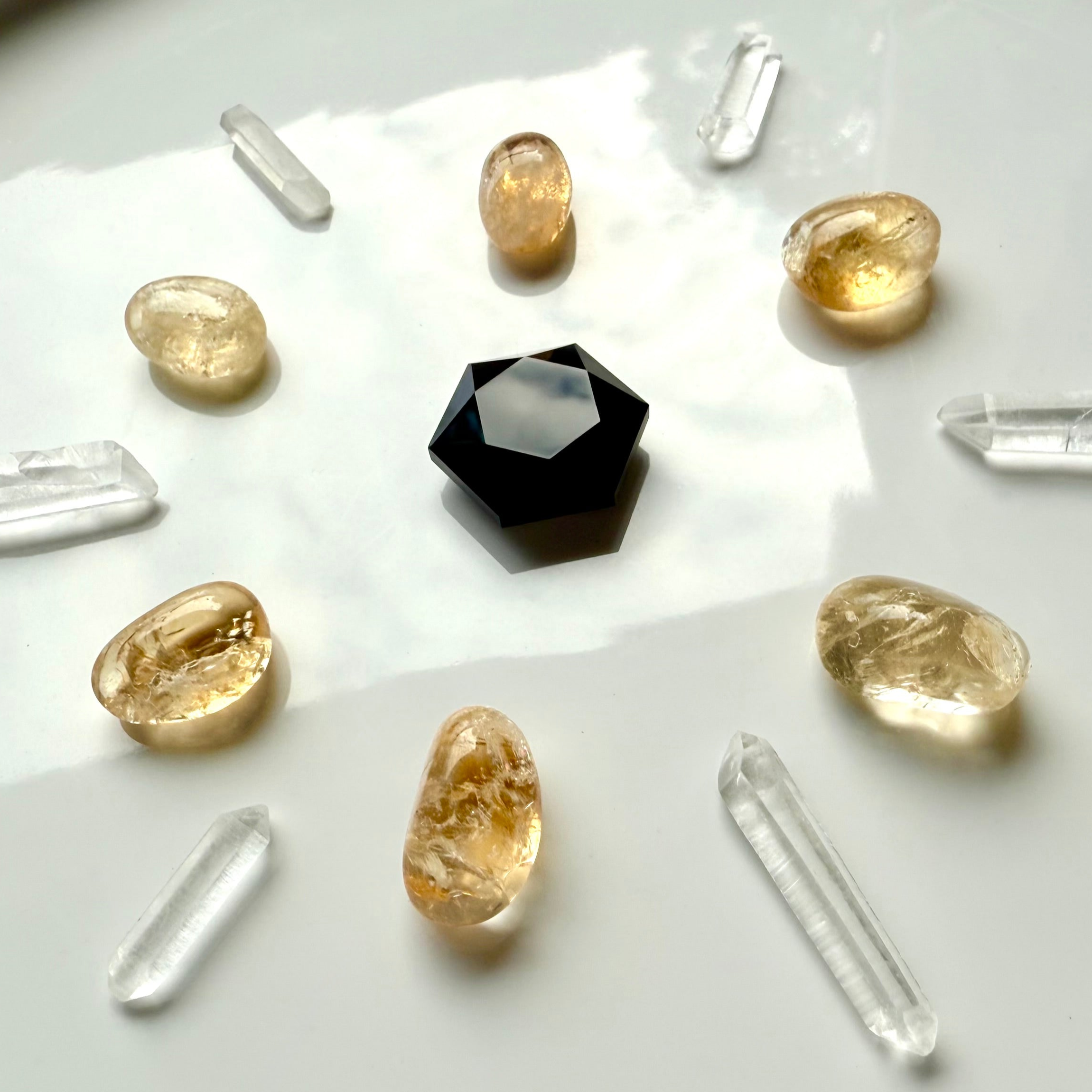 Crystal grid with black obsidian hexagon, citrine tumbles, and mini clear quartz points — mini crystals for energy healing and manifestation