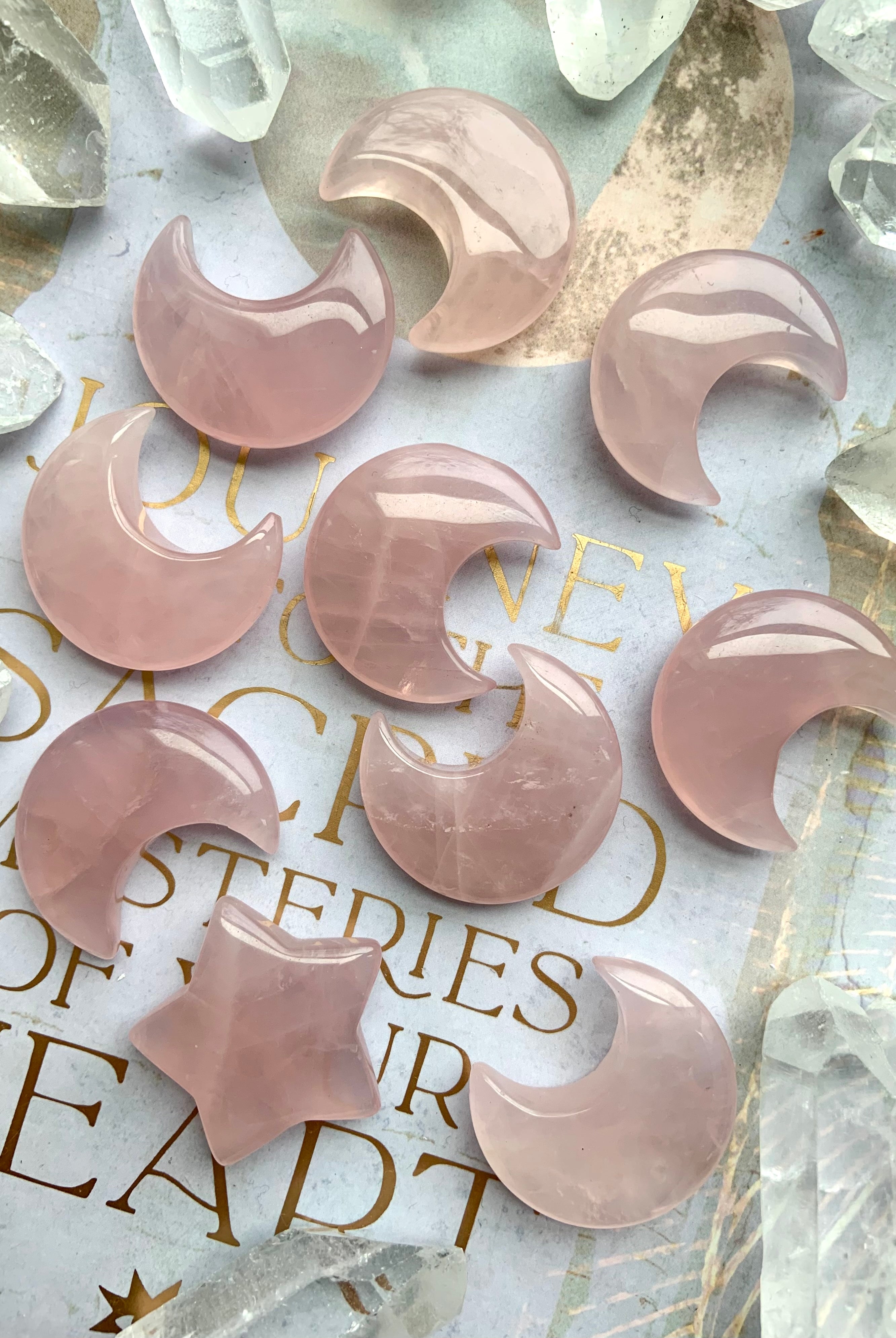 Rose quartz moon carvings on a lilac journal with gold details. Heart Chakra crystals for love, & soothing feminine energy.