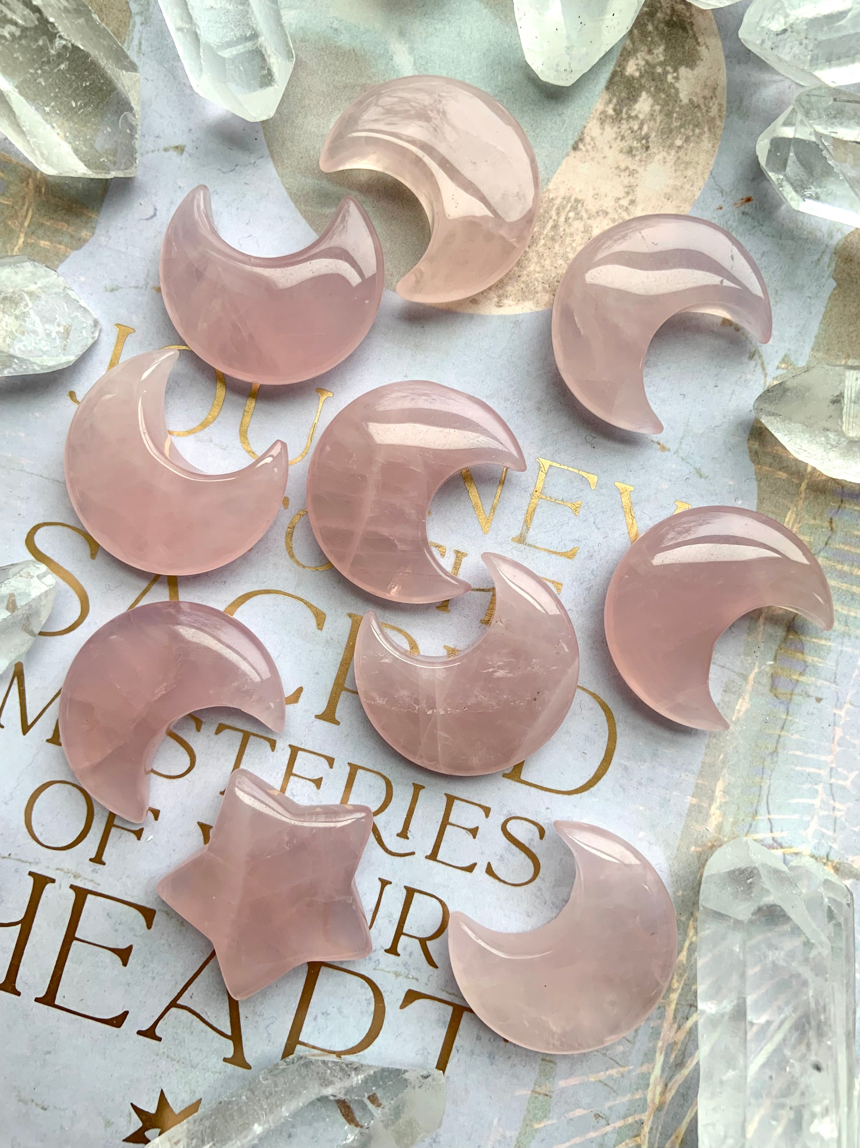 Rose quartz moon carvings on a lilac journal with gold details. Heart Chakra crystals for love, & soothing feminine energy.