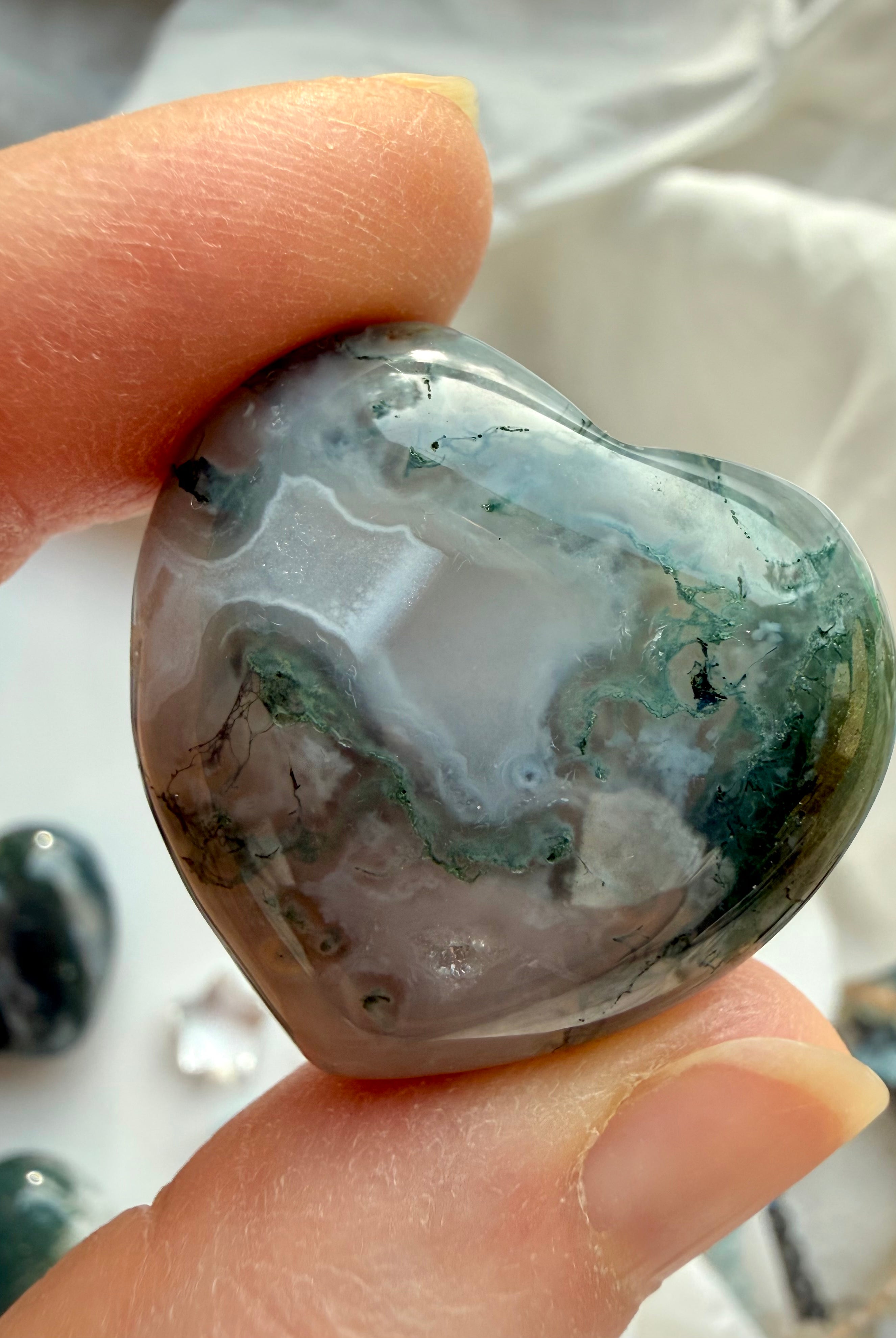 Translucent Moss Agate heart with delicate moss formations and smoky white quartz tones