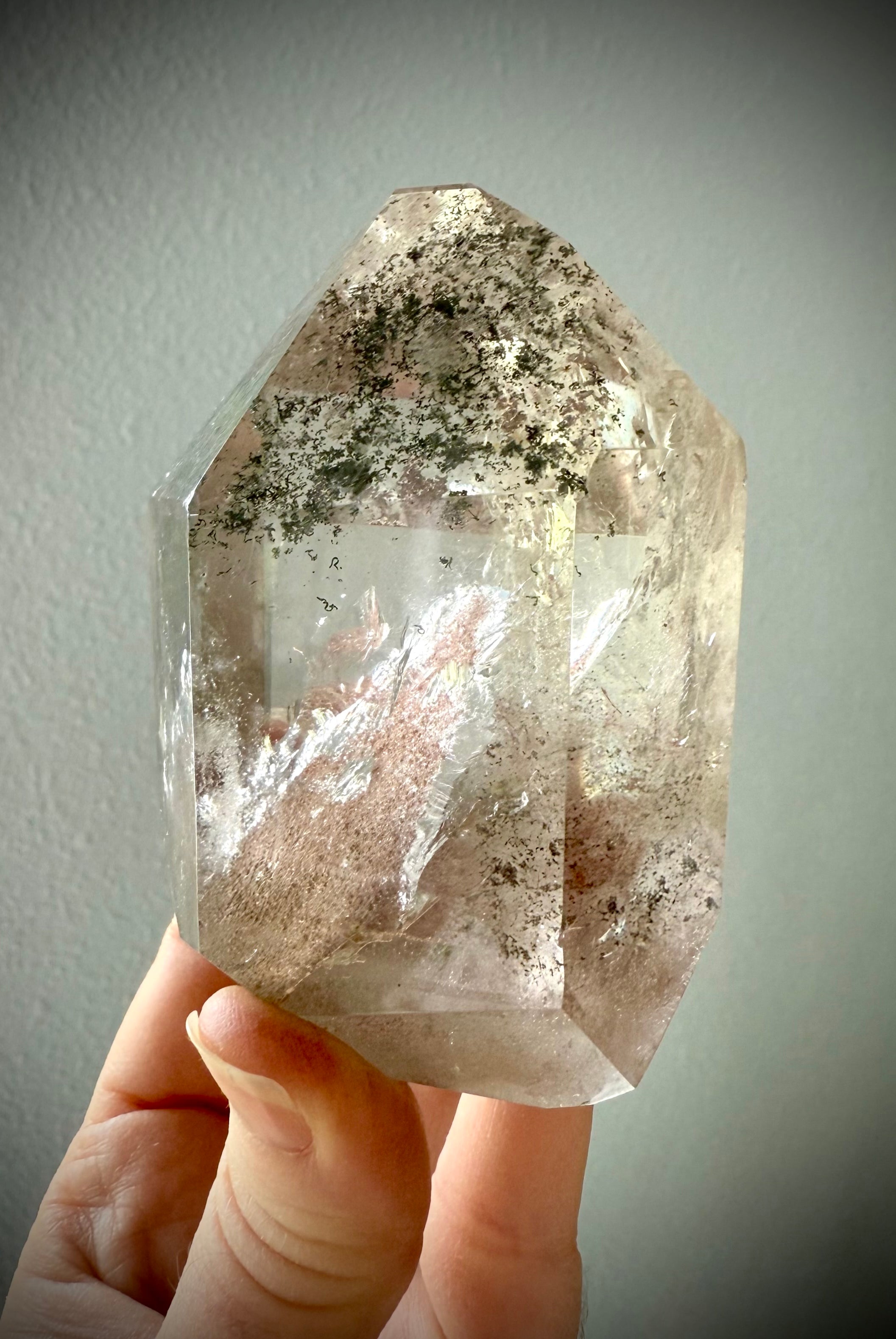 This Lodolite Garden Quartz Tower has a big reddish orange pyramid phantom, plus lots rainbows