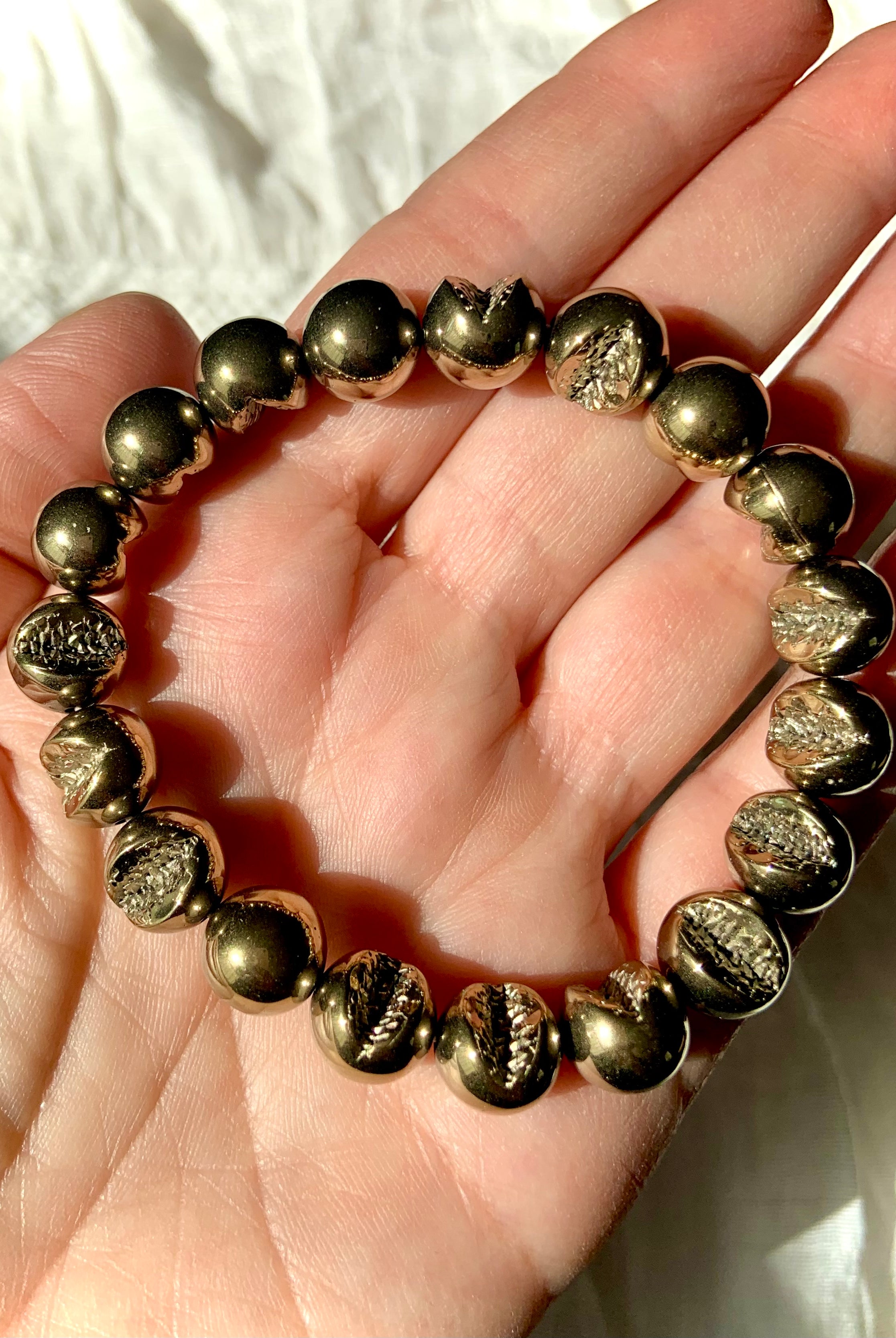 Round Pyrite bracelet with natural geode-like textures — golden crystal for confidence, protection, & grounding