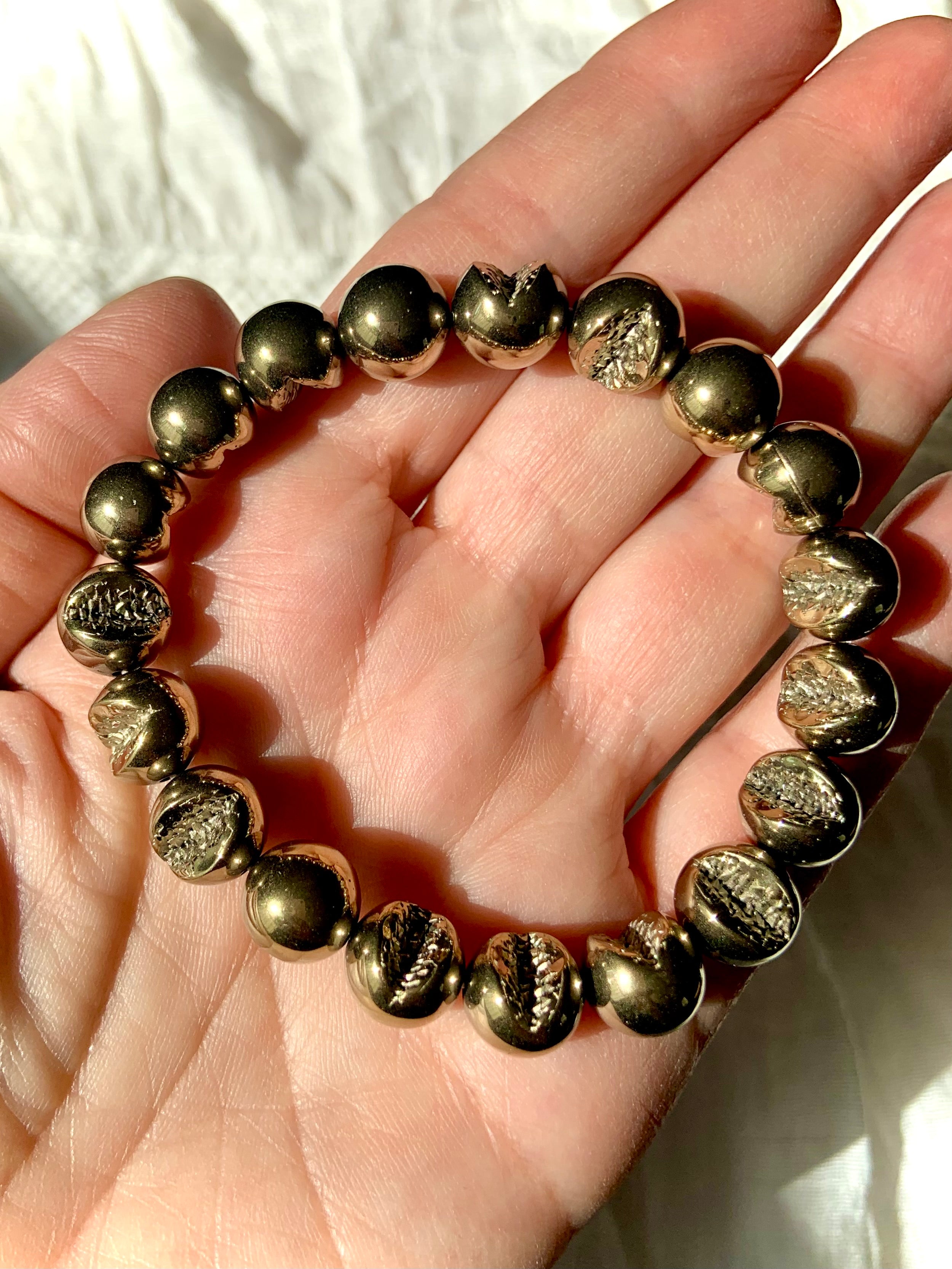 Round Pyrite bracelet with natural geode-like textures — golden crystal for confidence, protection, & grounding