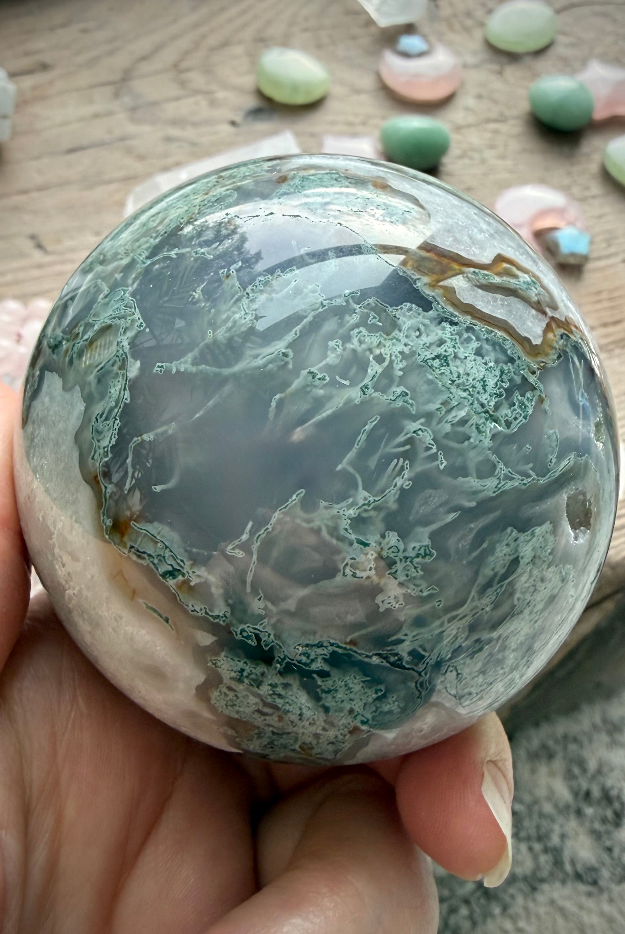 One of a kind Moss Agate crystal sphere with unique green, white, and gray chalcedony formations
