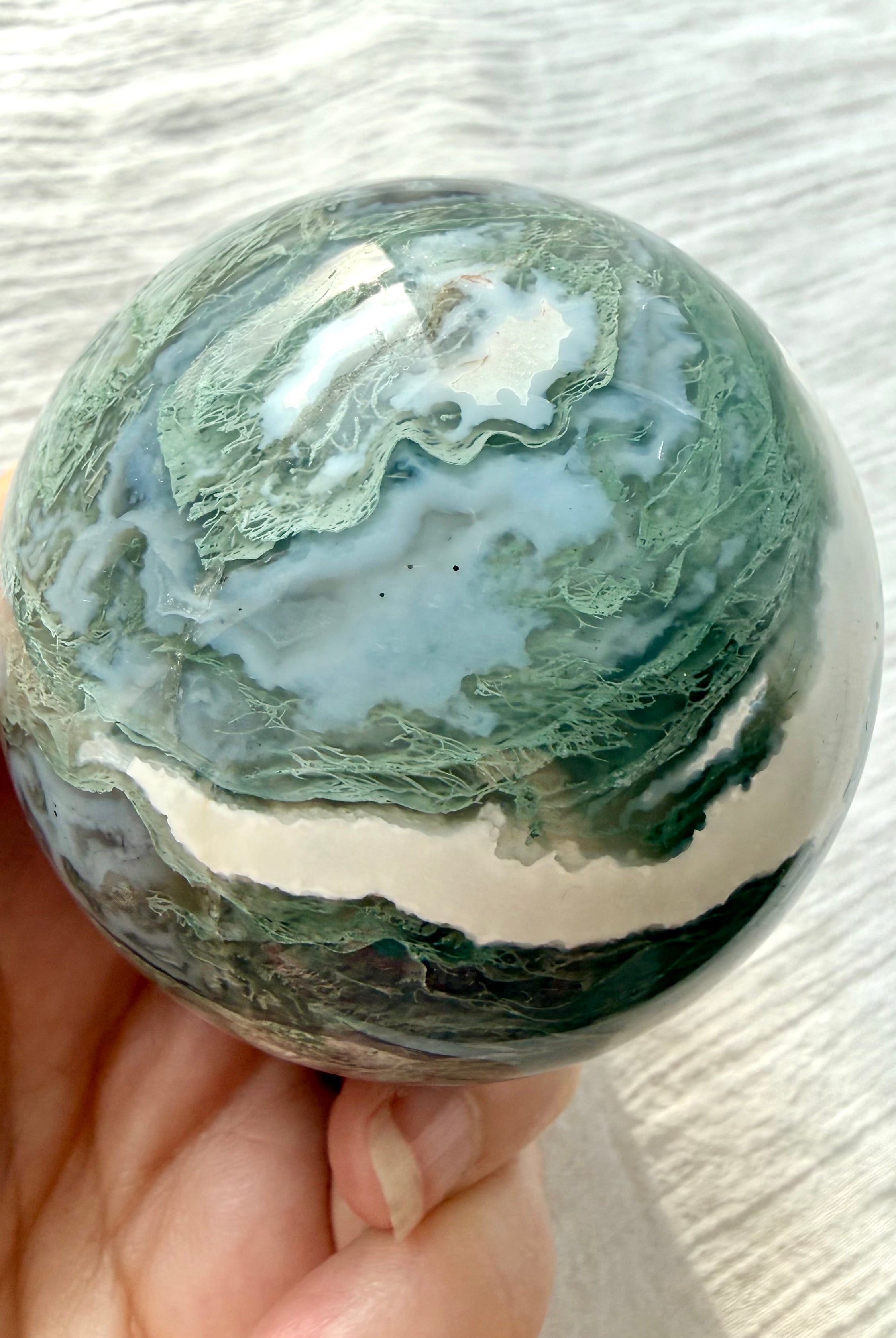 Moss Agate sphere with lacy mint green dendrites, blue gray chalcedony and white agate banding
