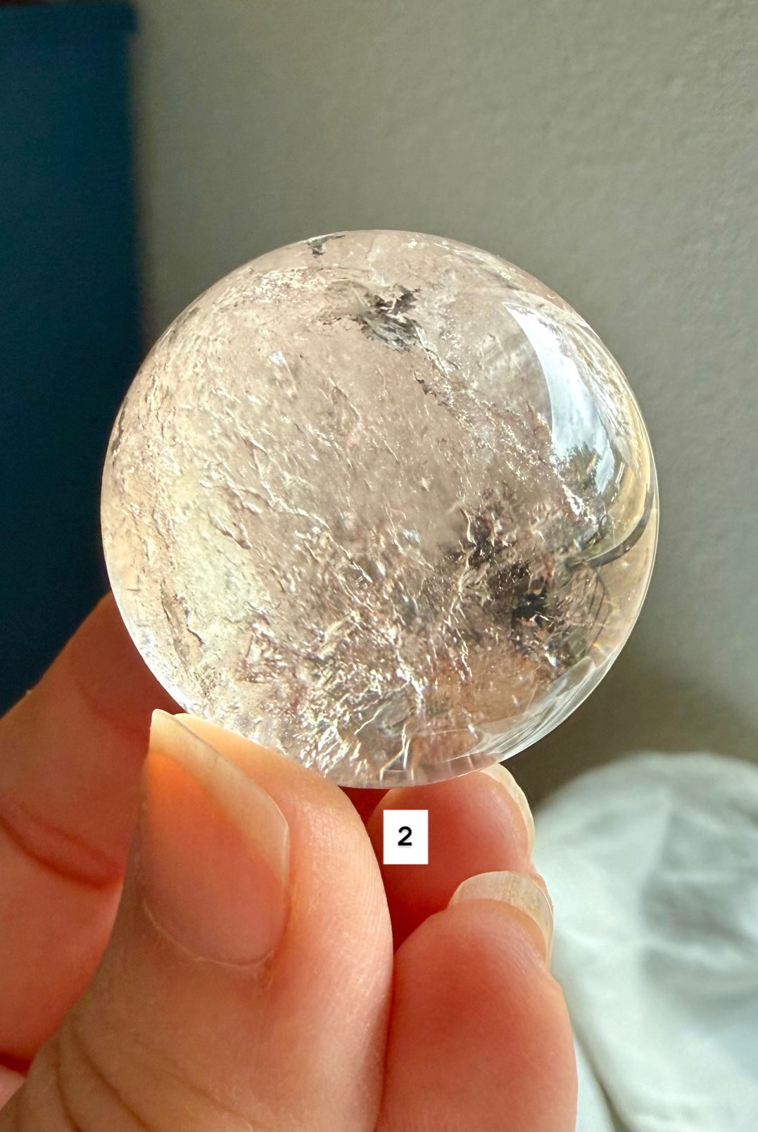 close up of a garden quartz sphere – mineral-filled lodolite for spiritual focus and grounding
