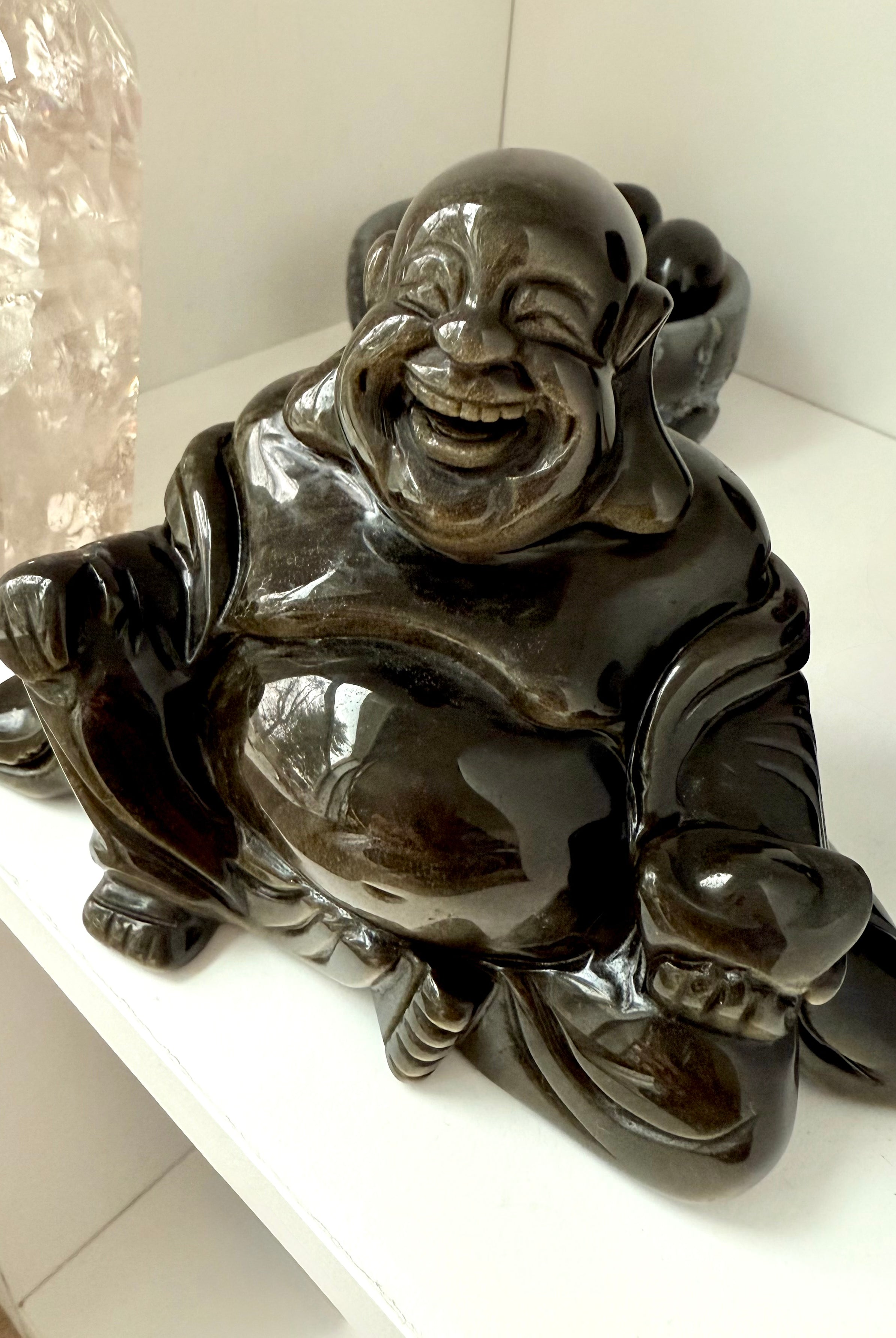 Golden Sheen Obsidian Happy Buddha displayed with pink Lemurian Quartz tower, perfect for altar decor or sacred space