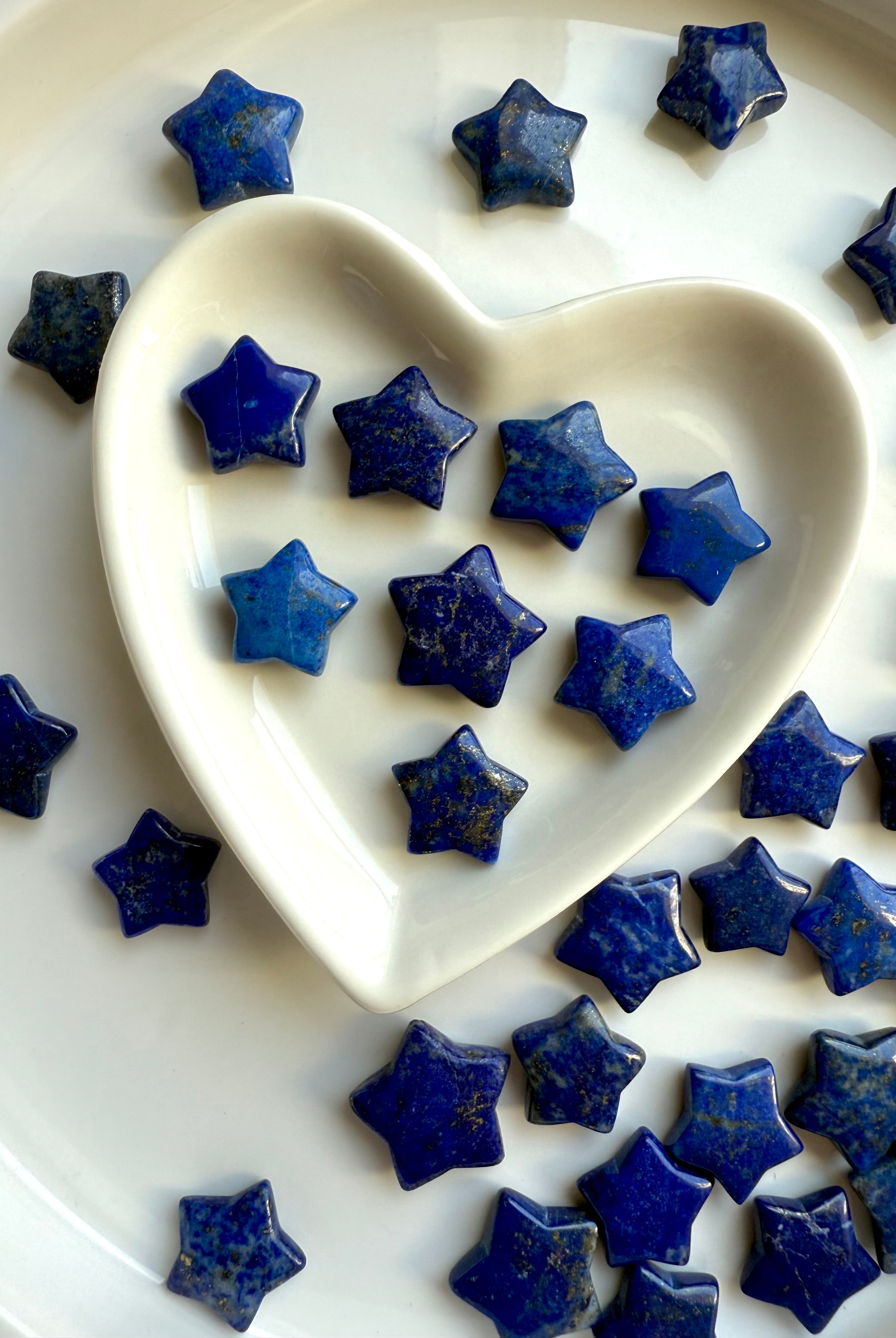 Assorted Lapis Lazuli star carvings showing size and color variation
