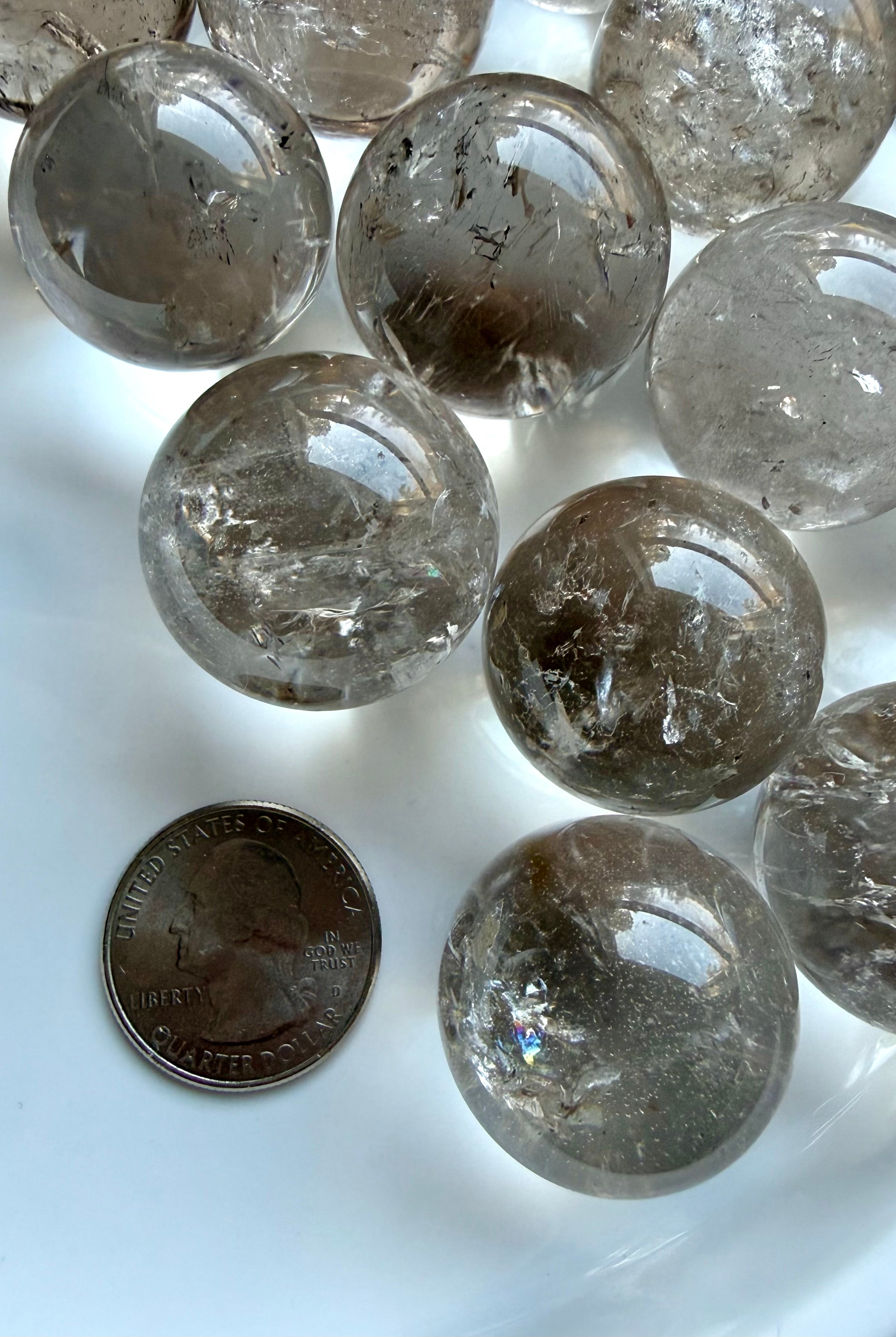 Collection of Smoky Quartz mini spheres with varied smoky tones and reflective polished surfaces