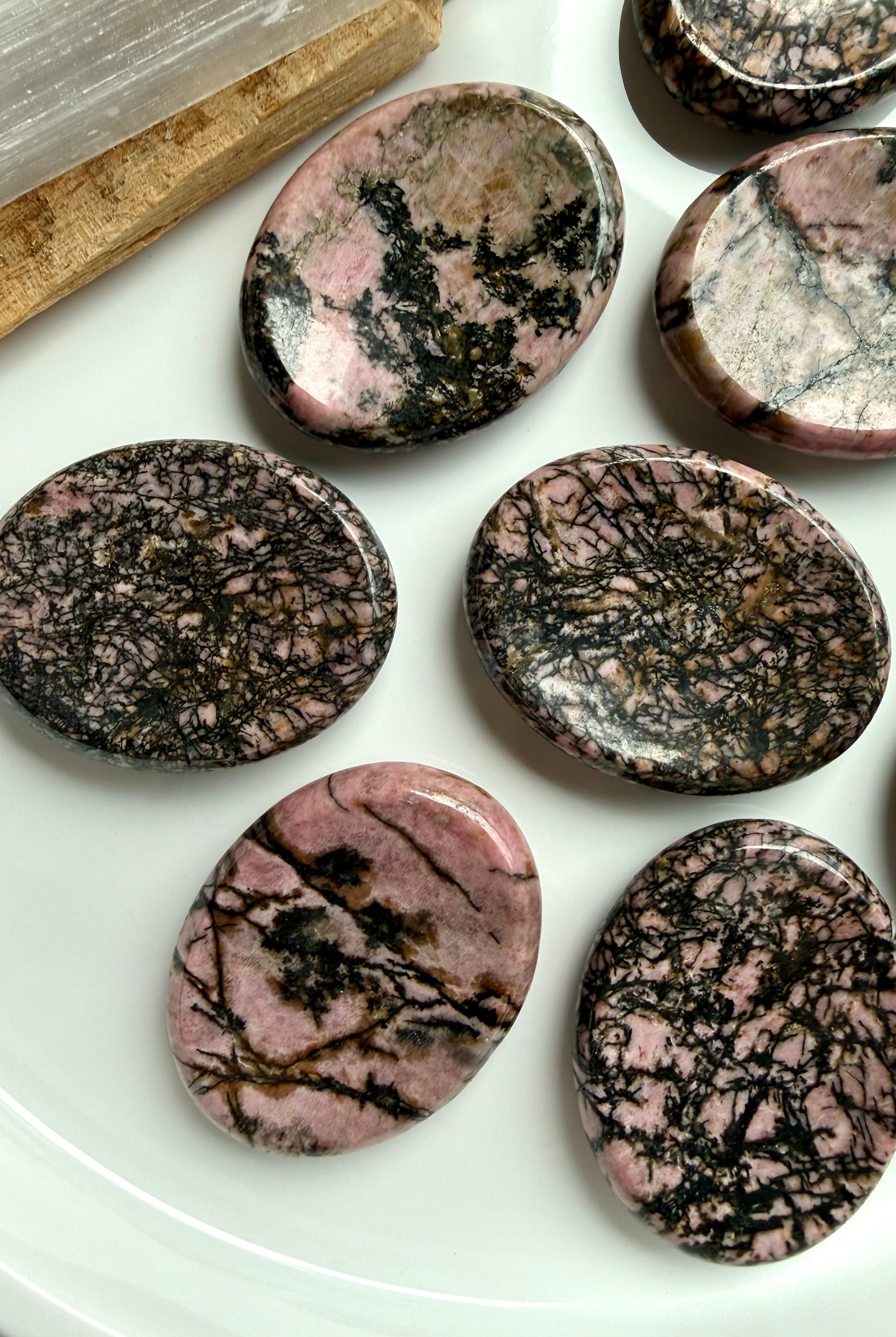Polished Rhodonite thumb stones with pink and black manganese matrix