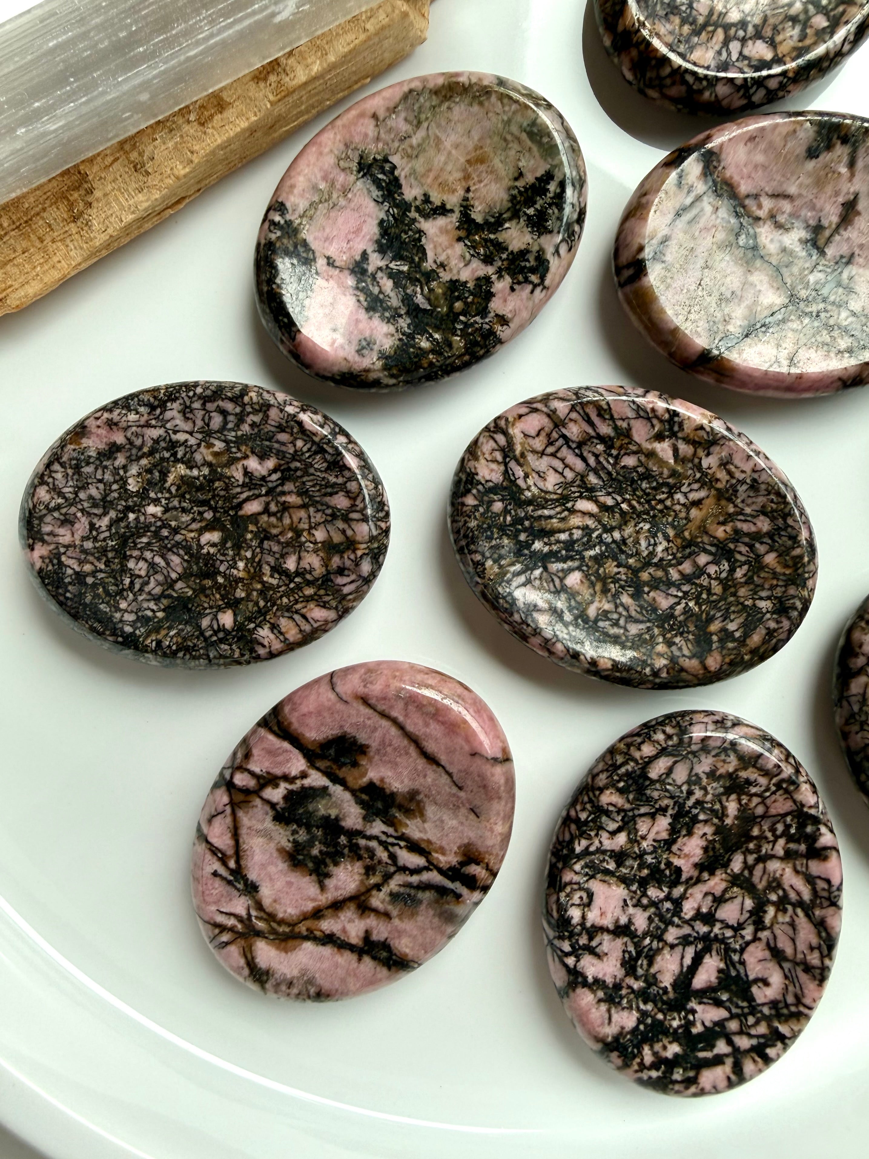Polished Rhodonite thumb stones with pink and black manganese matrix