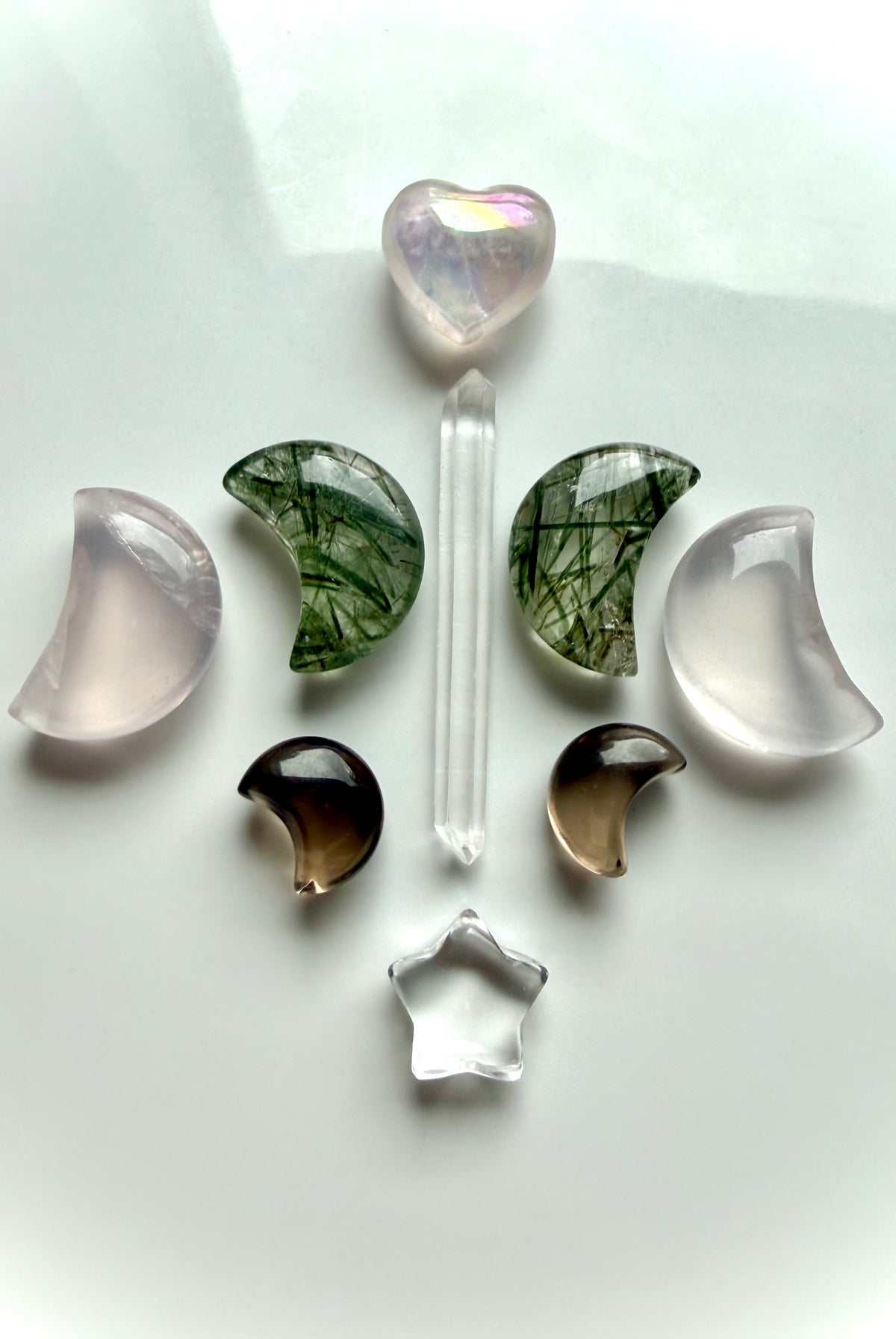 Celestial crystal grid with Smoky Quartz moons, Clear Quartz, Rose Quartz, Green Rutilated Quartz and Aura Rose Quartz heart