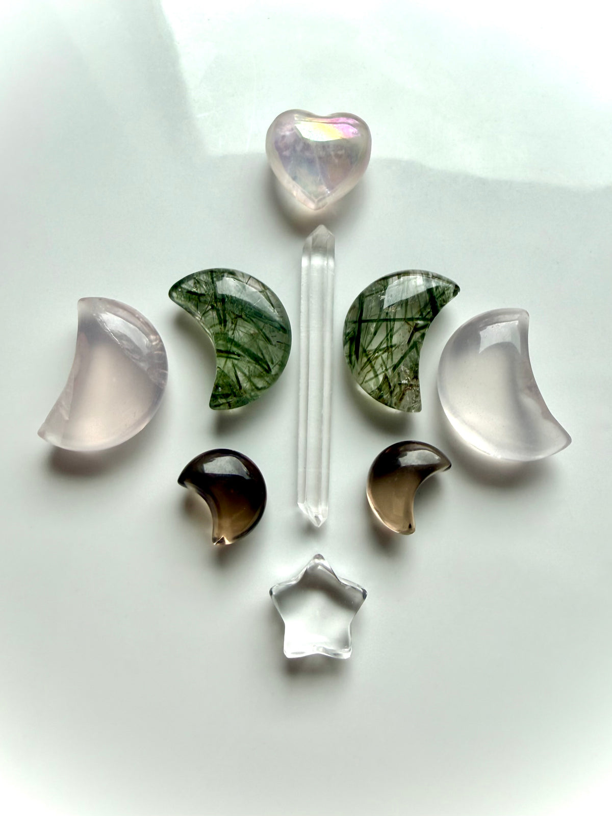 Celestial crystal grid with Smoky Quartz moons, Clear Quartz, Rose Quartz, Green Rutilated Quartz and Aura Rose Quartz heart