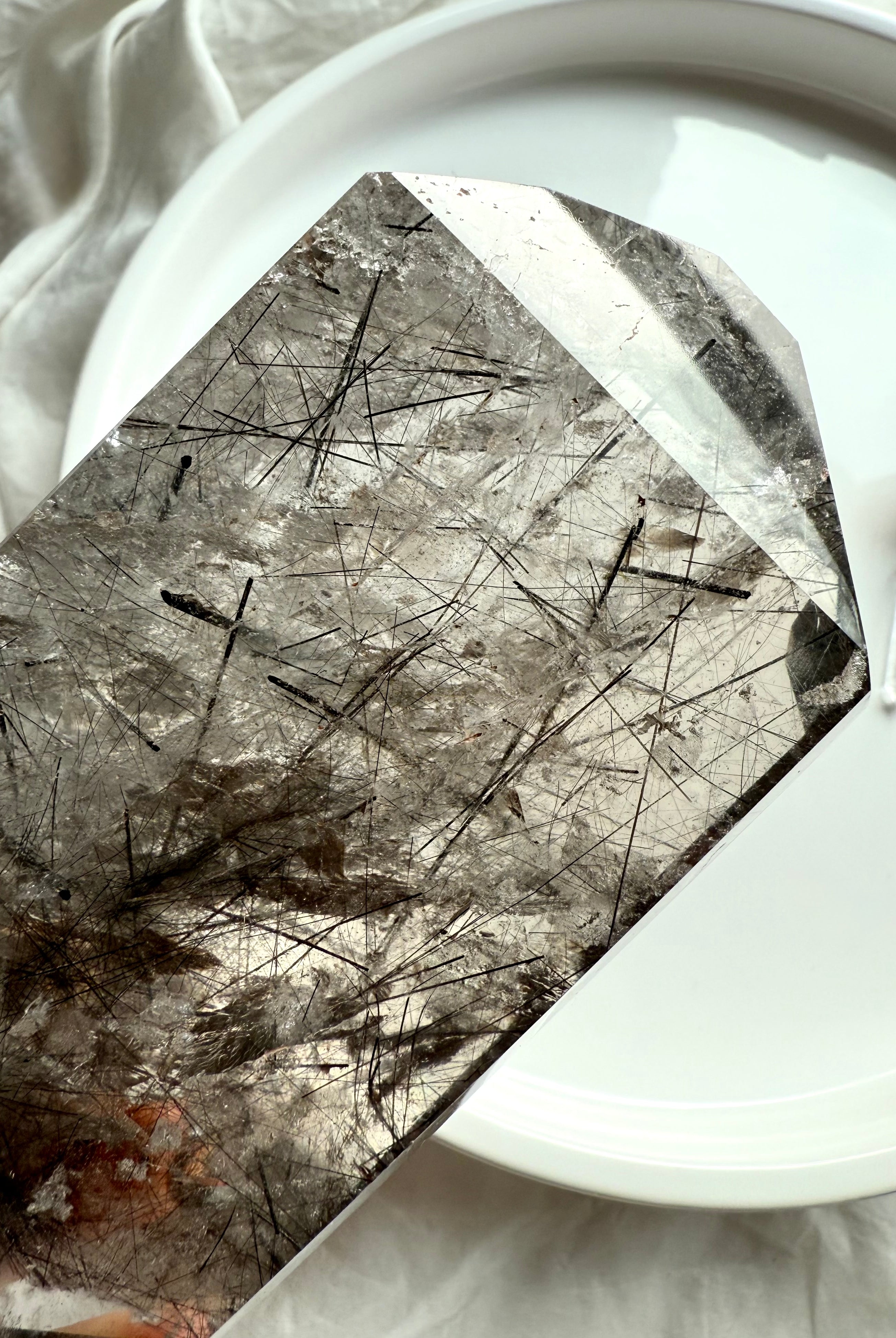 Tourmalinated Quartz crystal tower glowing in sunlight with smoky clarity and natural inclusions