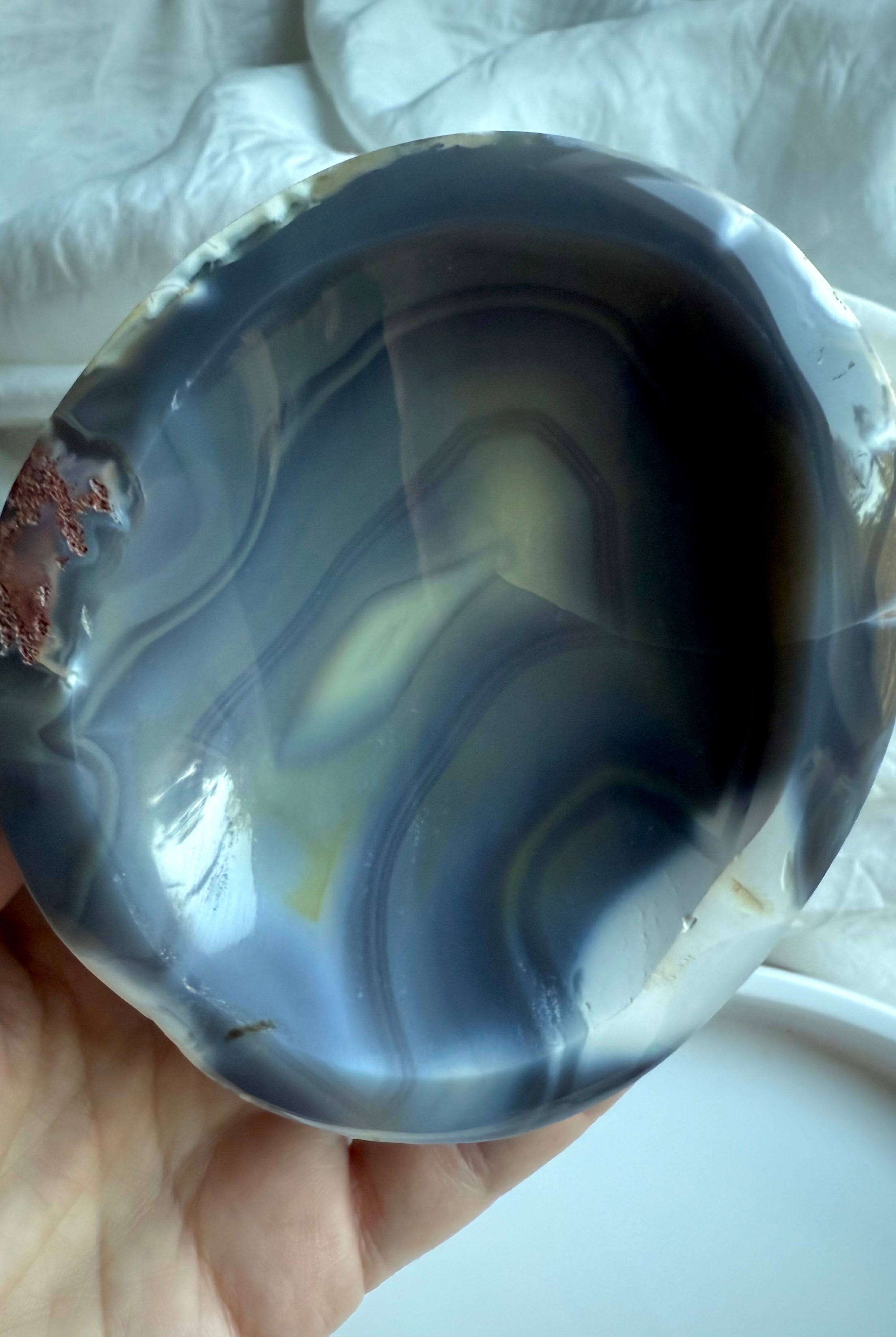 Orca Agate bowl interior with dramatic black, grey, and cream banding — smooth hand-carved crystal bowl for offerings, intention setting, and energy cleansing.