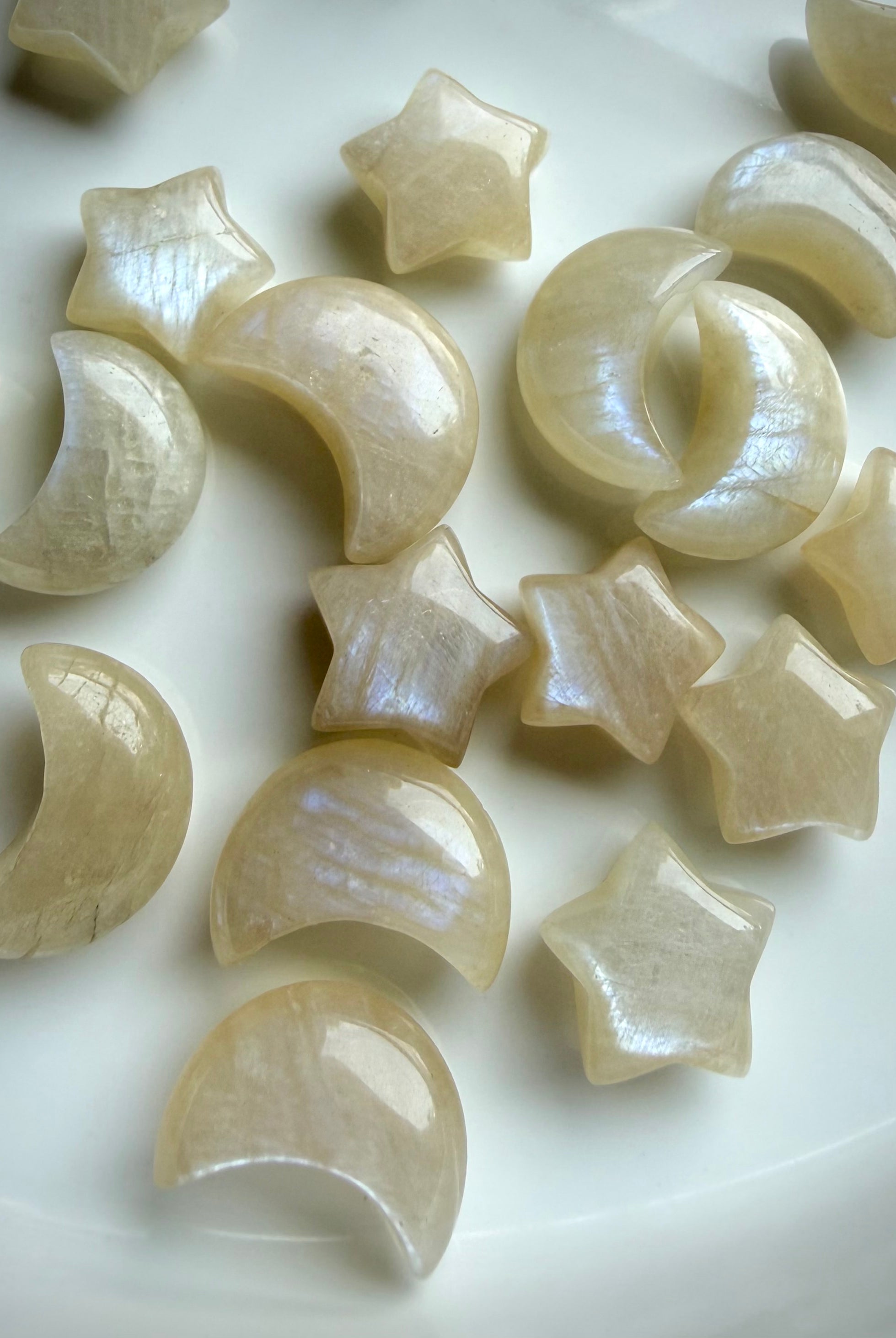 Moonstone moon and star crystal carvings with beautiful blue-white flash and creamy ivory color