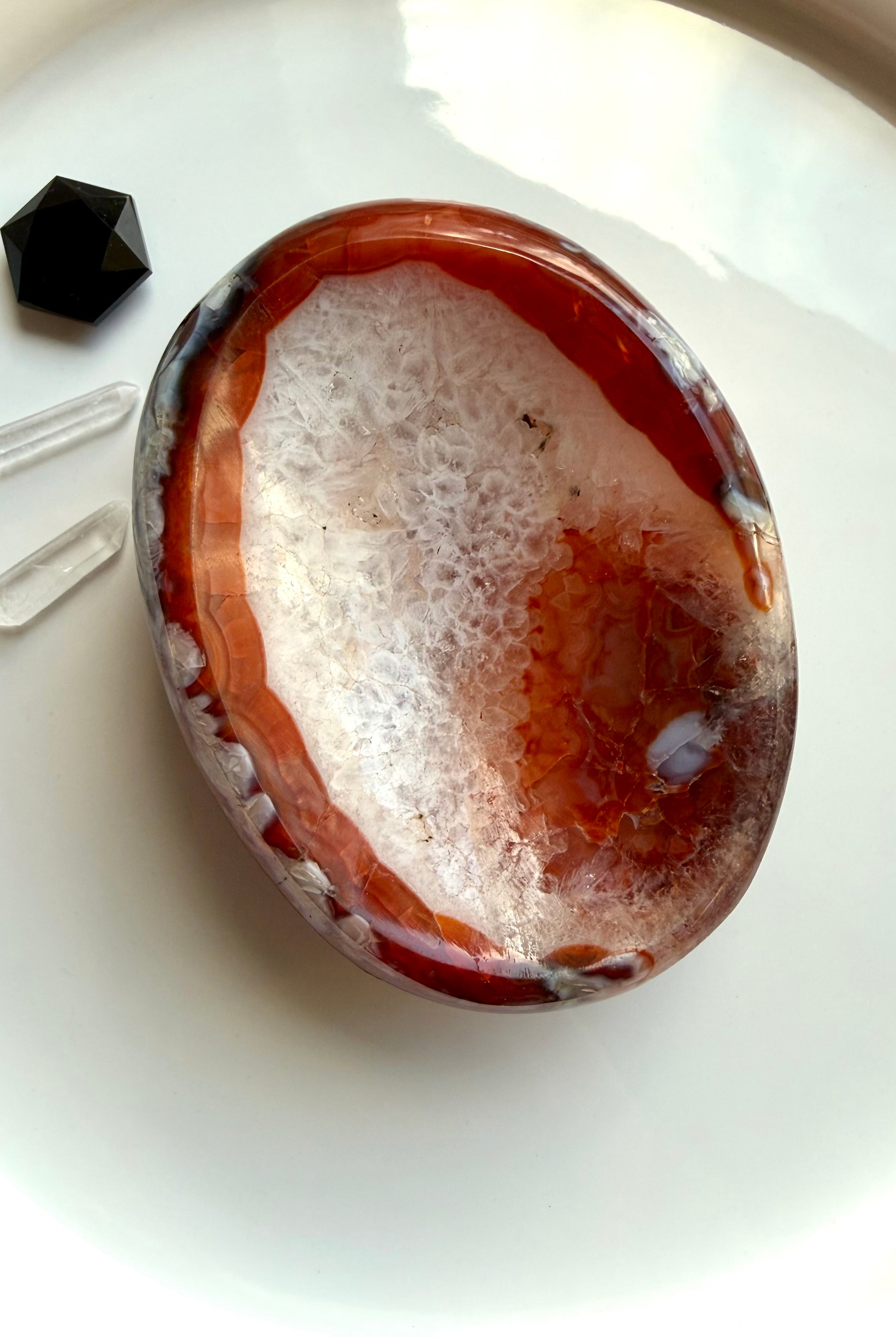 carnelian gemstone bowl with white quartz center used as ring dish and crystal display