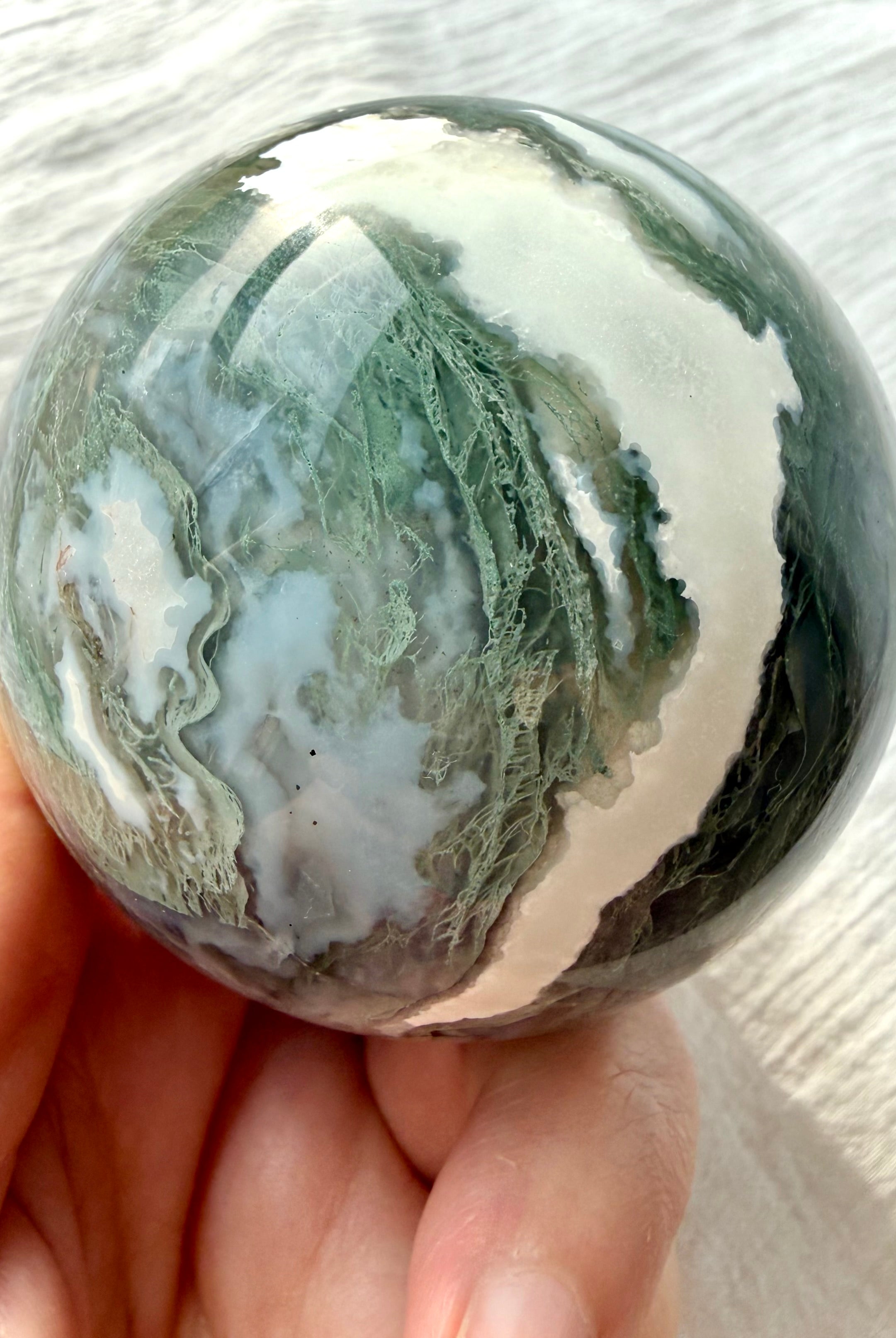 Polished Moss Agate crystal sphere with pale green dendritic inclusions and white agate