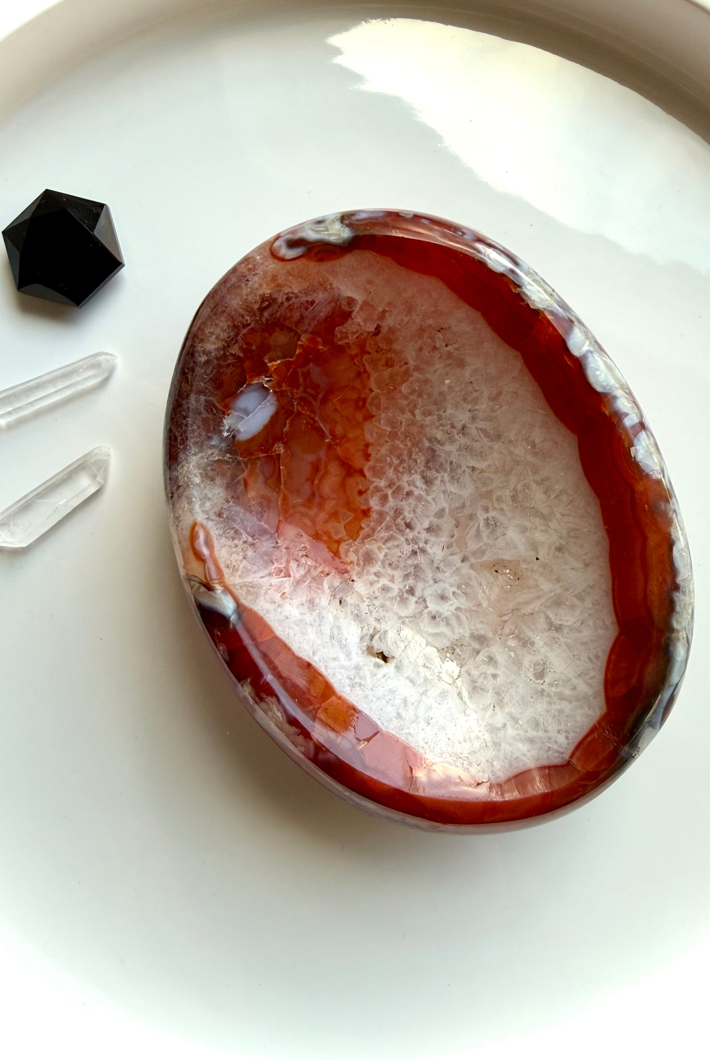 red carnelian crystal bowl with agate banding and quartz inclusions for altar decor