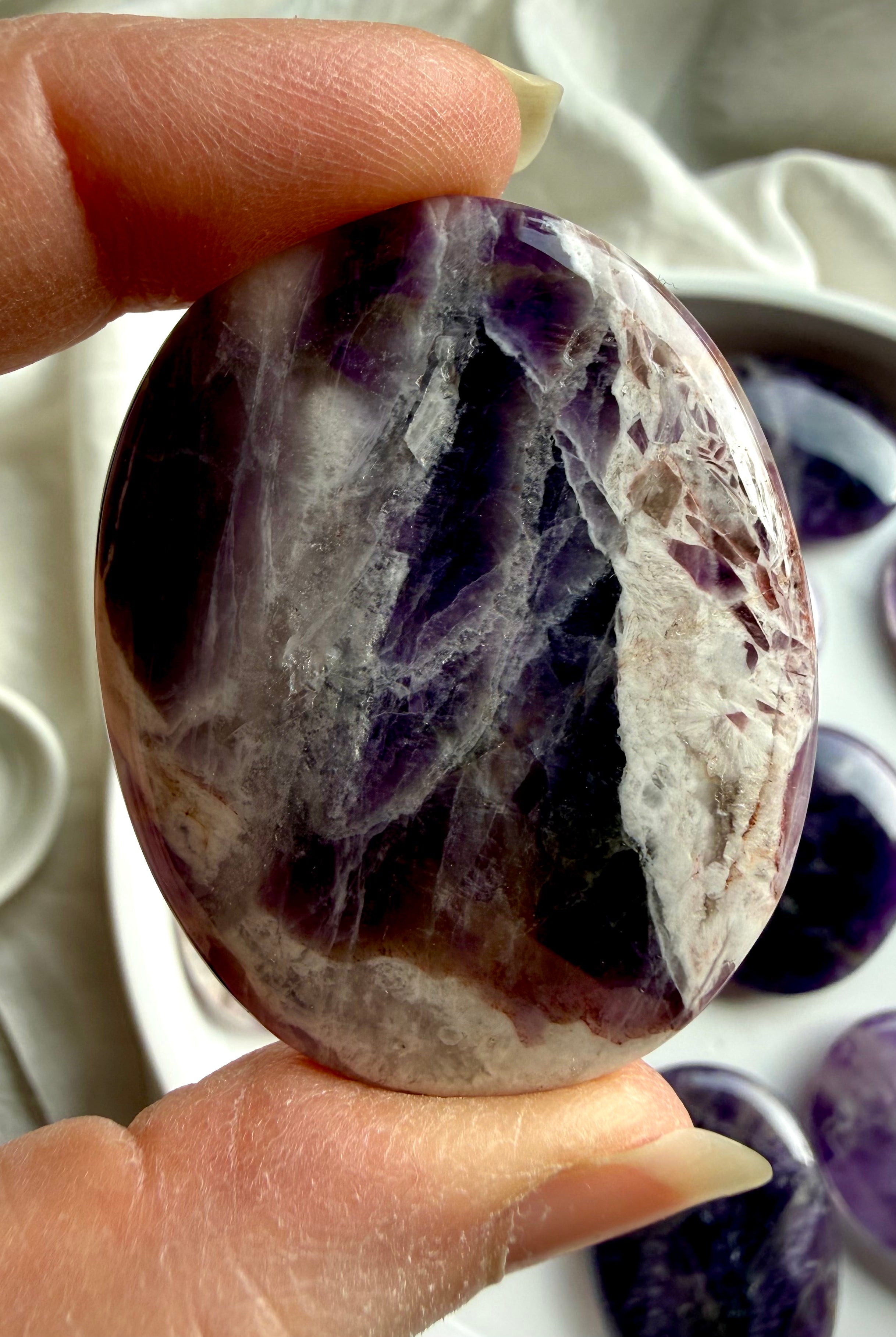 natural dream amethyst crystal palm stone with soft lavender tones