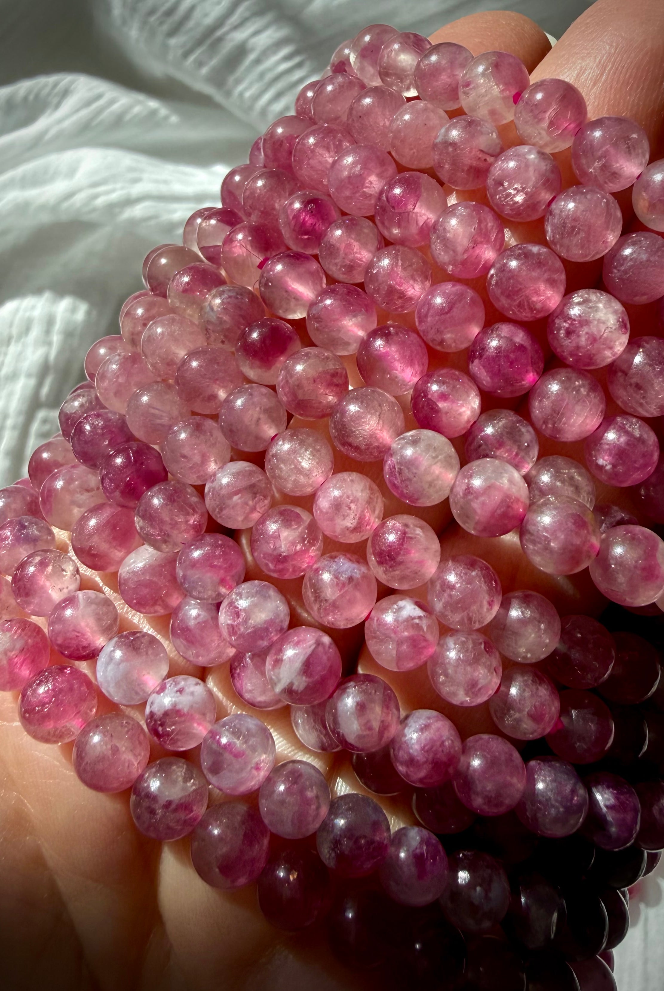 Pink Tourmaline bracelet with luminous pink gemstone beads in blush, raspberry, and berry tones for love, compassion, and Heart Chakra healing