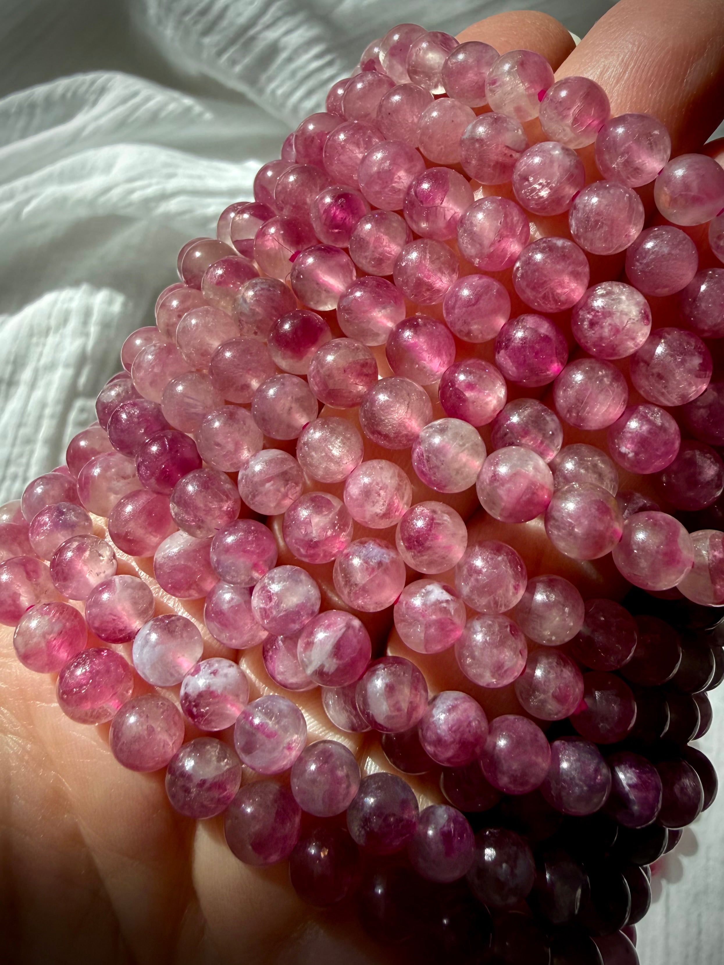 Pink Tourmaline bracelet with luminous pink gemstone beads in blush, raspberry, and berry tones for love, compassion, and Heart Chakra healing