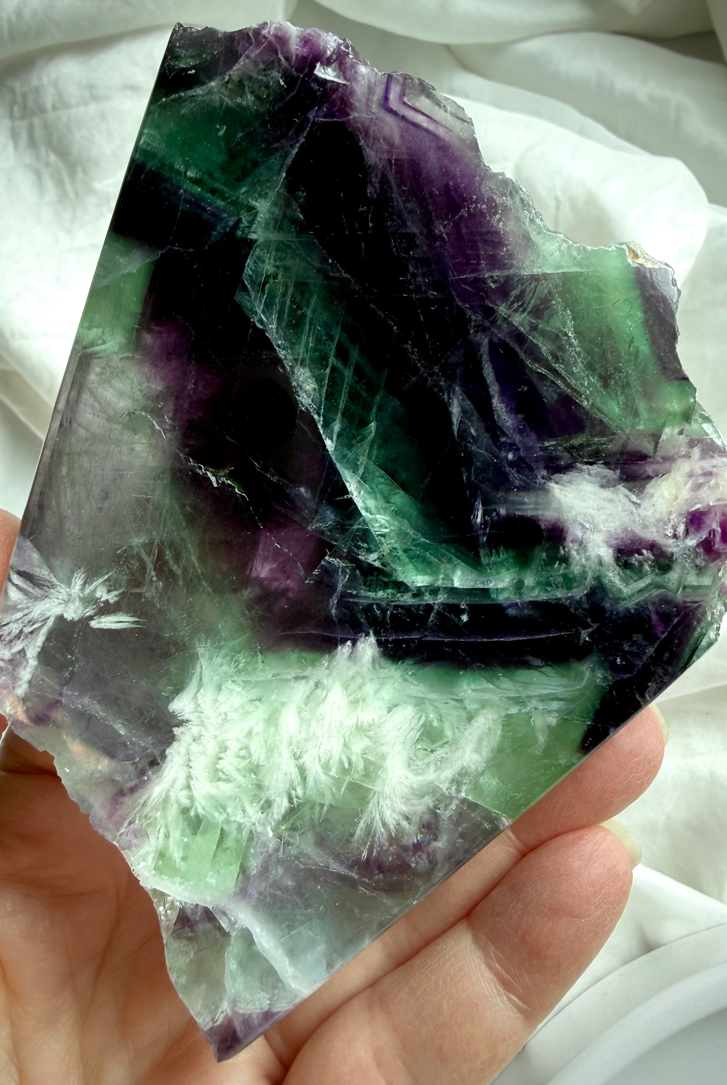 one of a kind fluorite slab with scolecite inclusions, smooth polished face, and natural crystal patterns