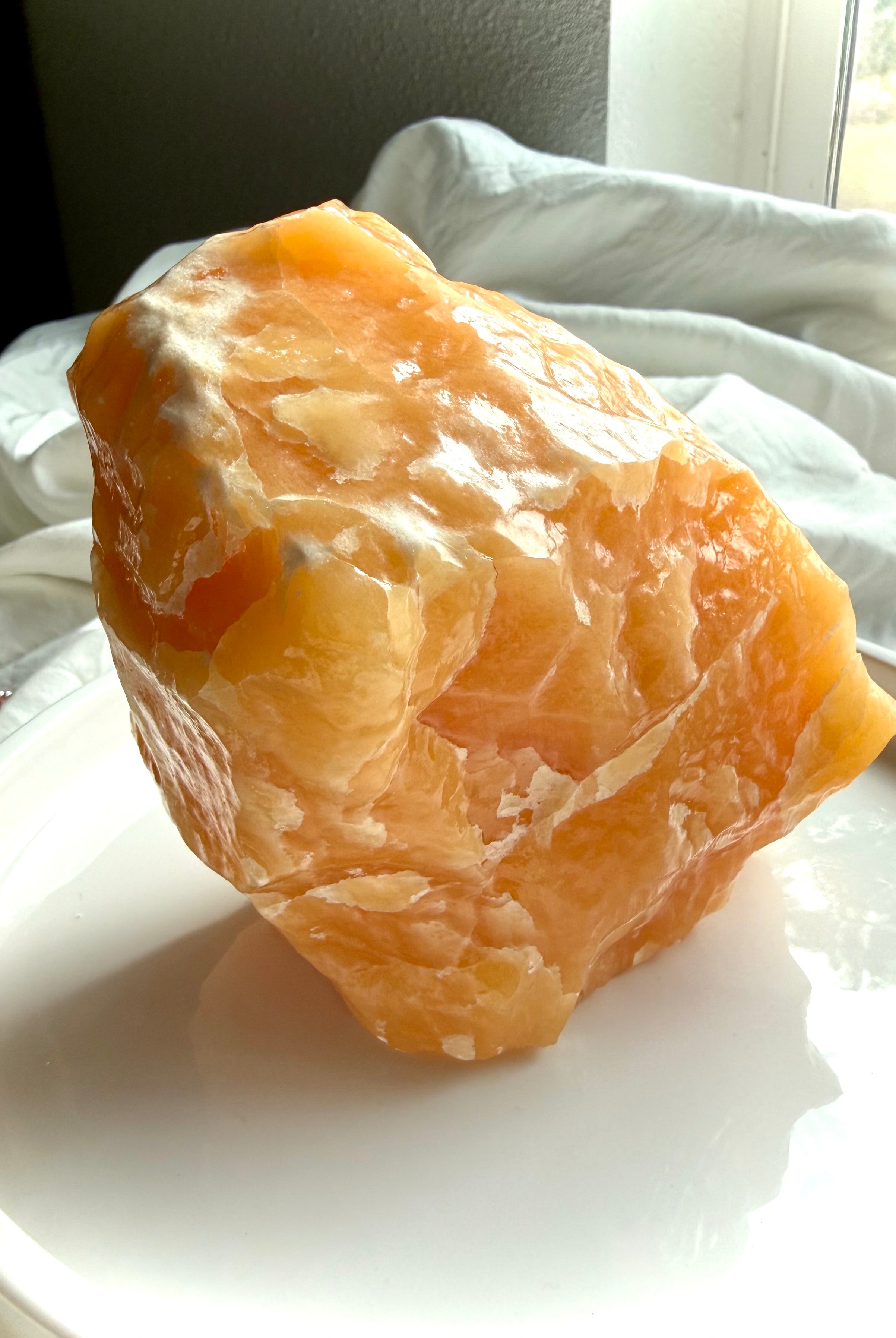 Large Orange Calcite display crystal with natural white calcite formations and sculptural mineral structure