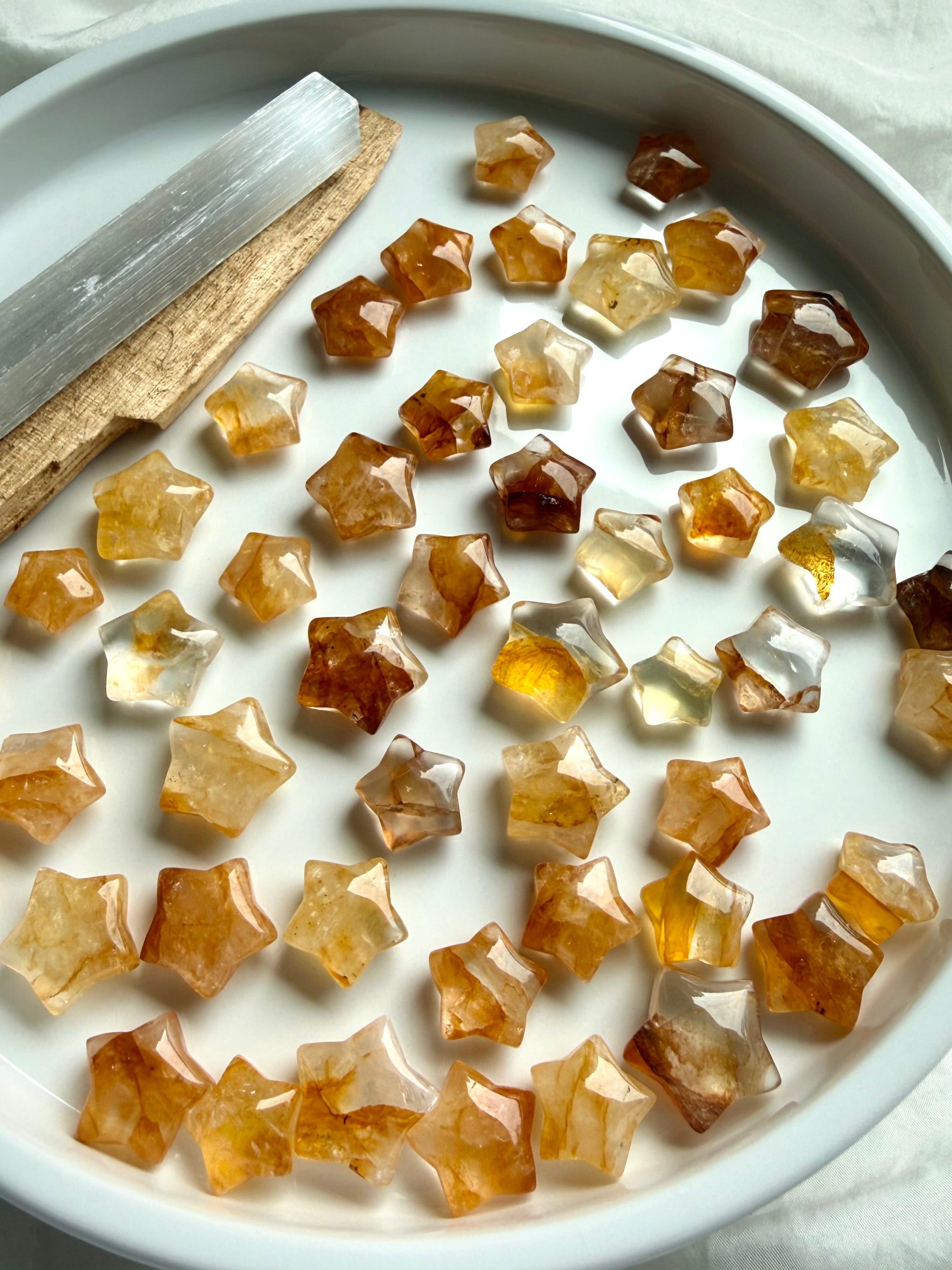 Golden Healer Quartz crystal stars showing golden Hematoid inclusions and polished mini star carvings for healing energy