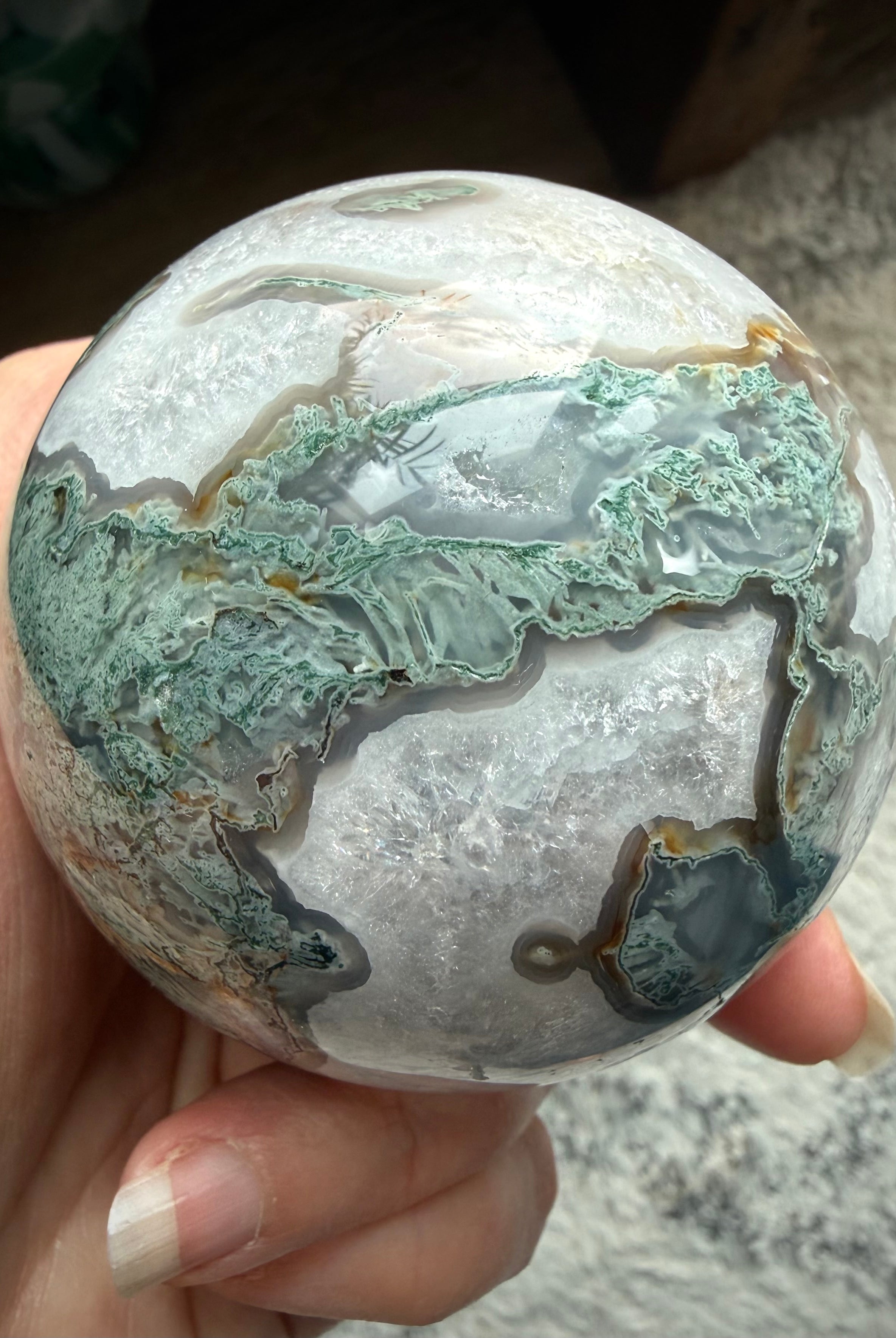 Moss Agate crystal sphere with stand featuring natural druzy texture and polished crystal surface