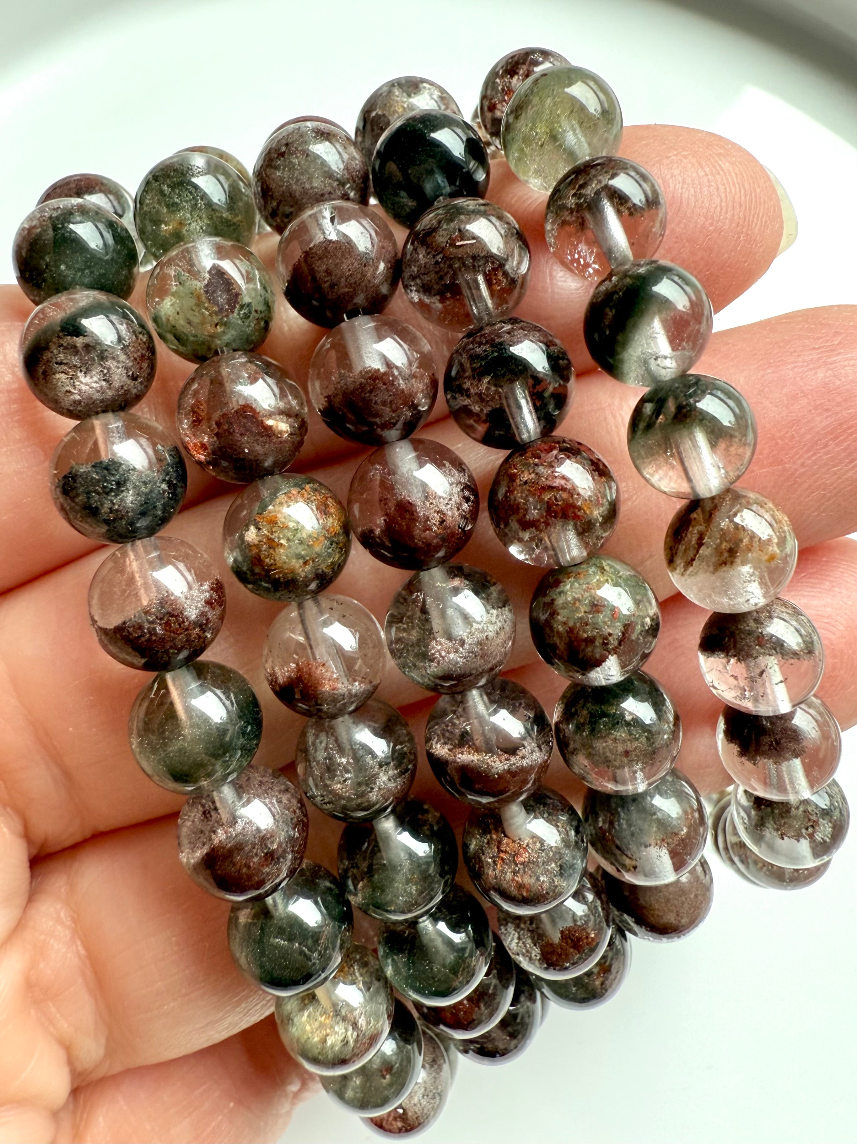 Garden Quartz bracelets with earthy, forest-toned inclusions and high-polish finish, close-up