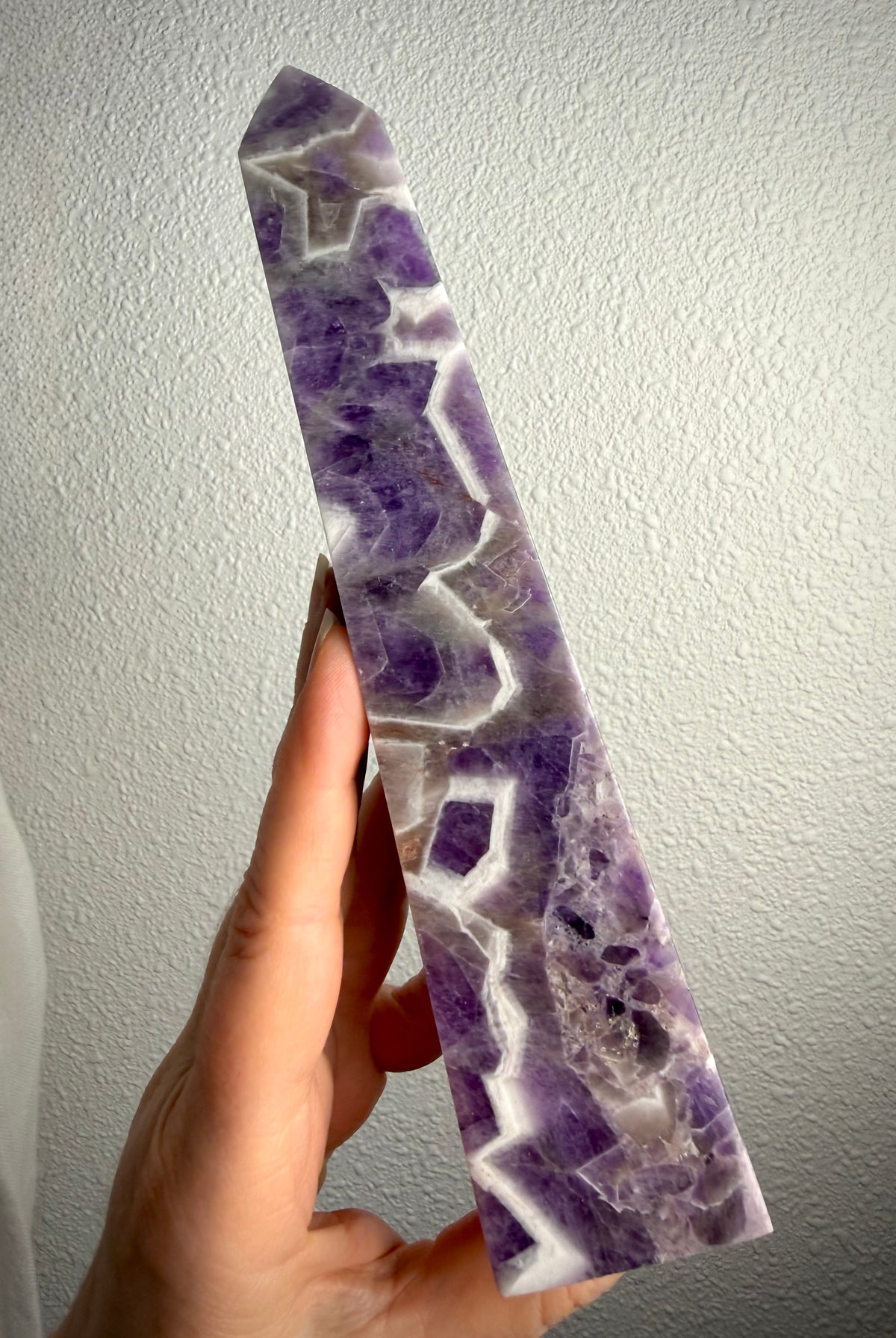 Dream Amethyst tower with striking purple and white Chevron Amethyst patterns, polished crystal point for intuition and spiritual growth