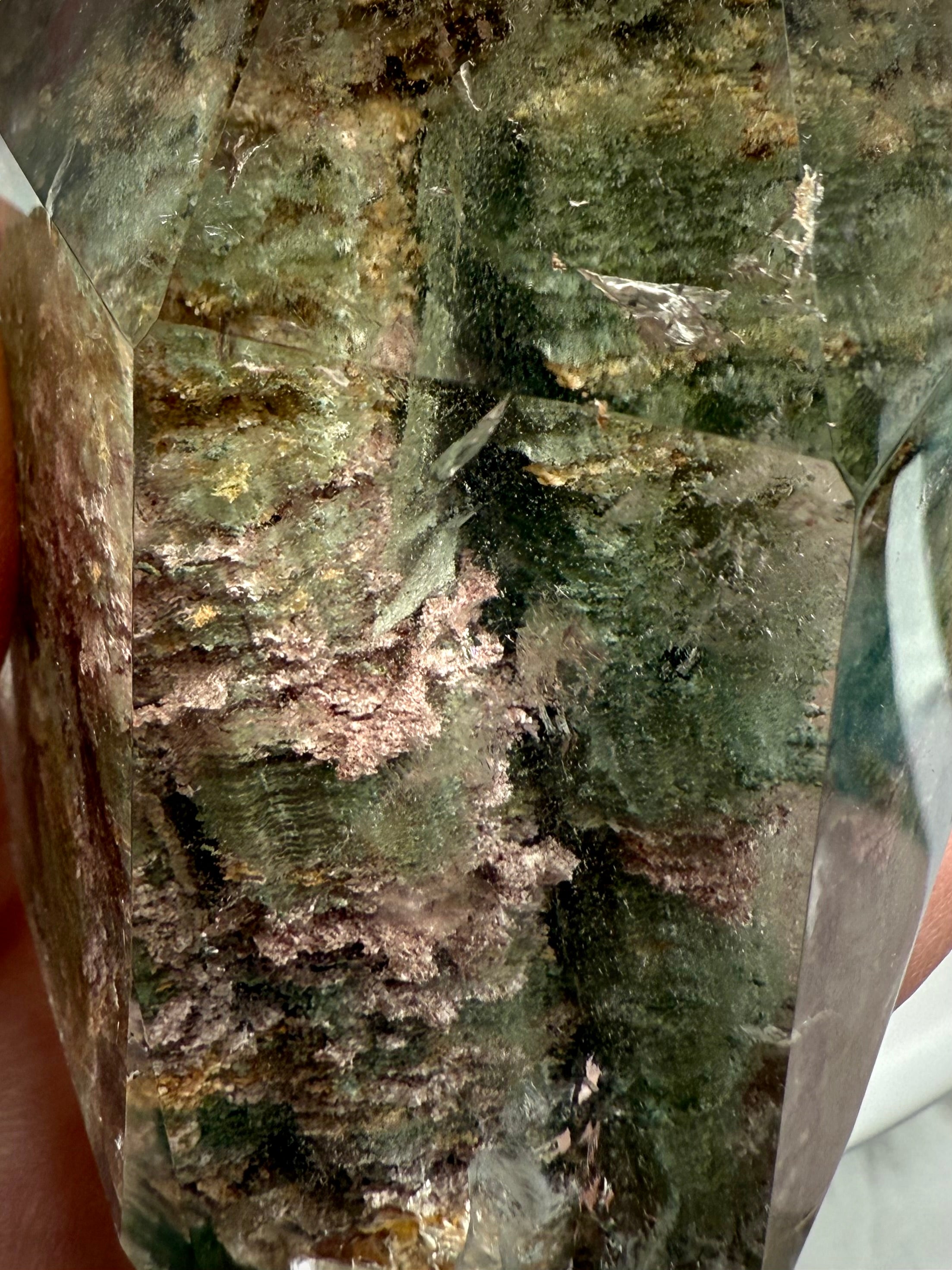 Close up of Thousand Layer Garden Quartz phantom crystal revealing intricate layered mineral formations