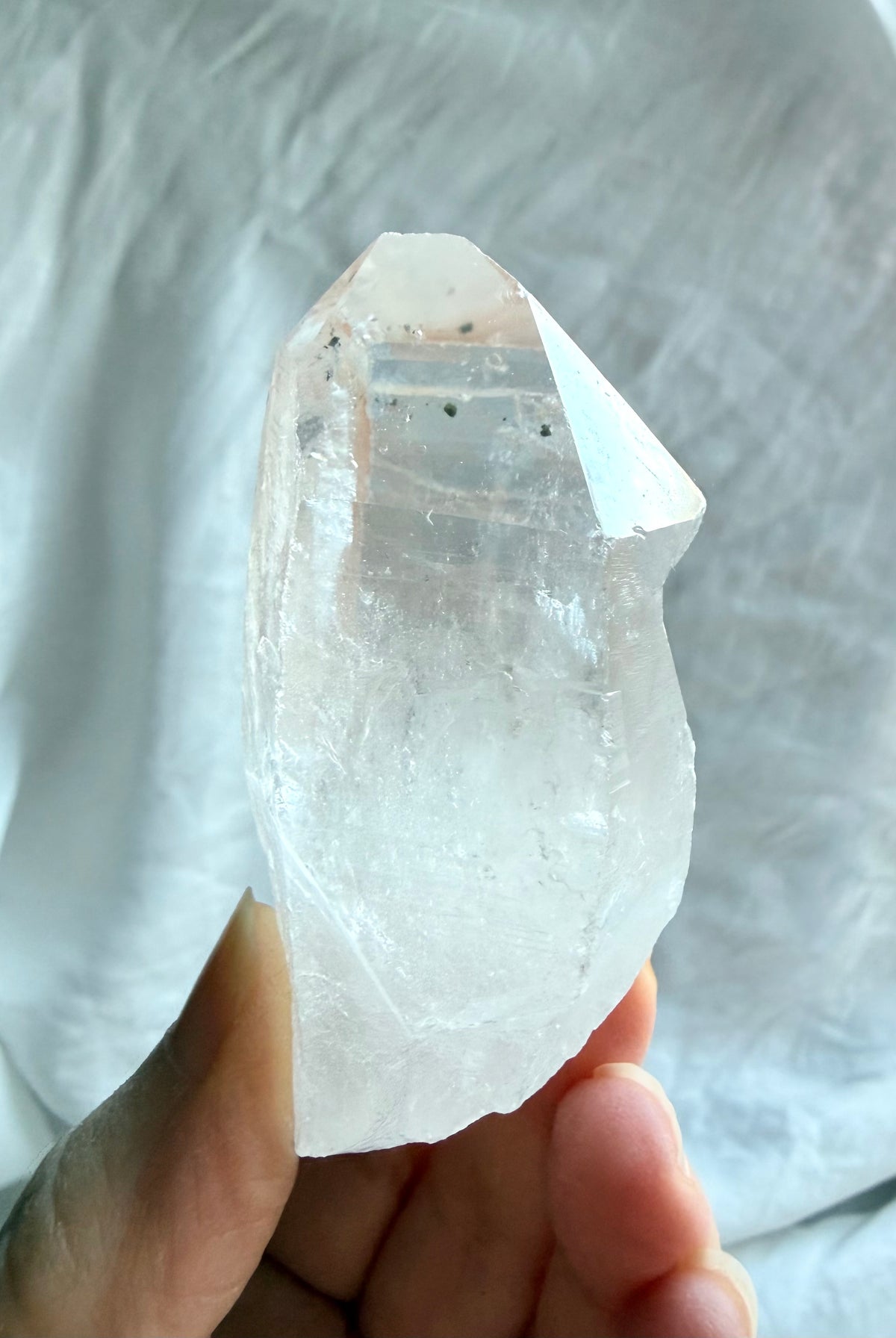Chunky Clear Quartz point from Brazil with Lemurian ladder lines, natural inclusions, and a broad crystal termination