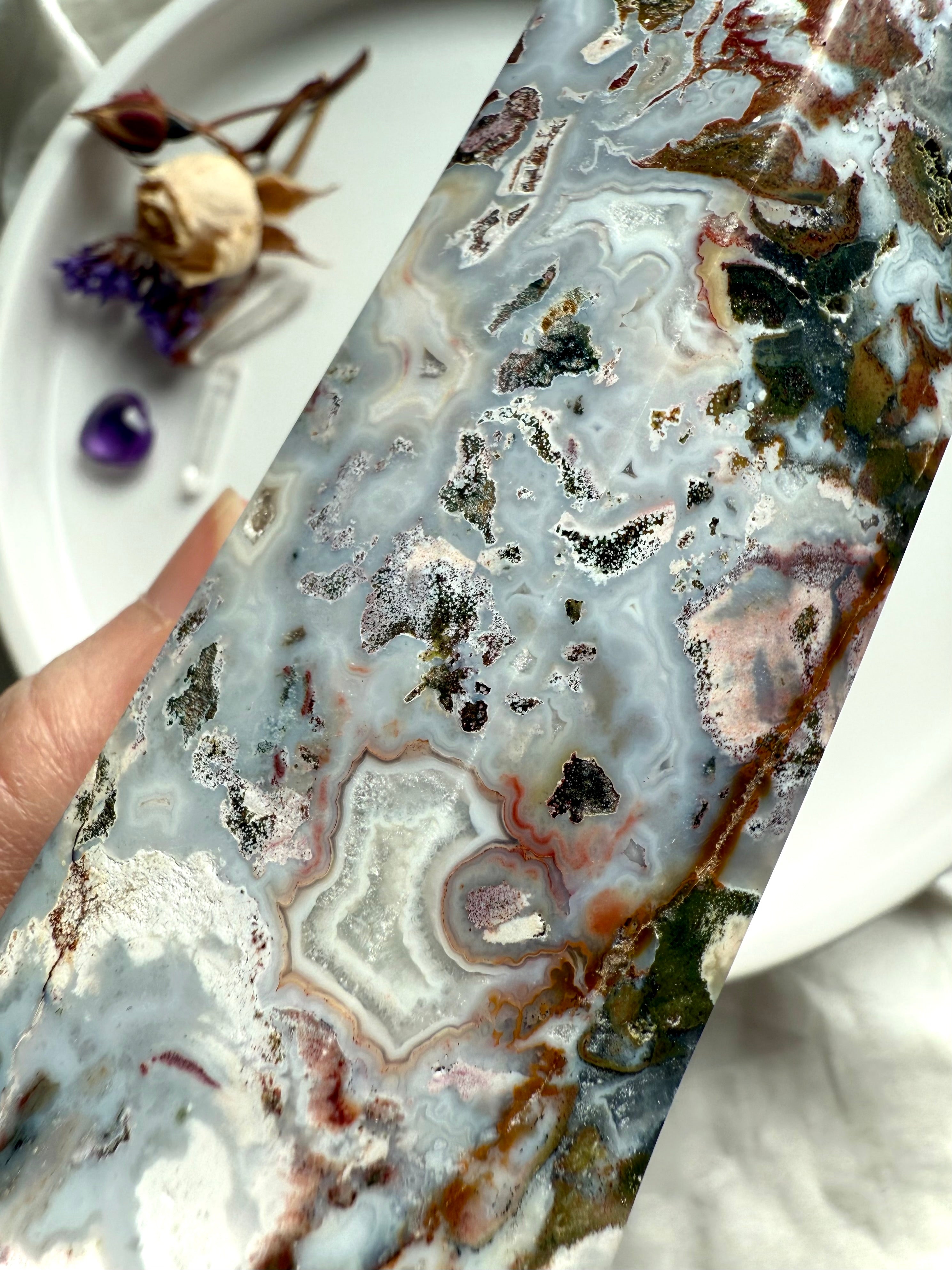 Detailed view of Cosmic Ocean Jasper crystal with natural chalcedony veins, druzy sparkle, and organic mineral formations