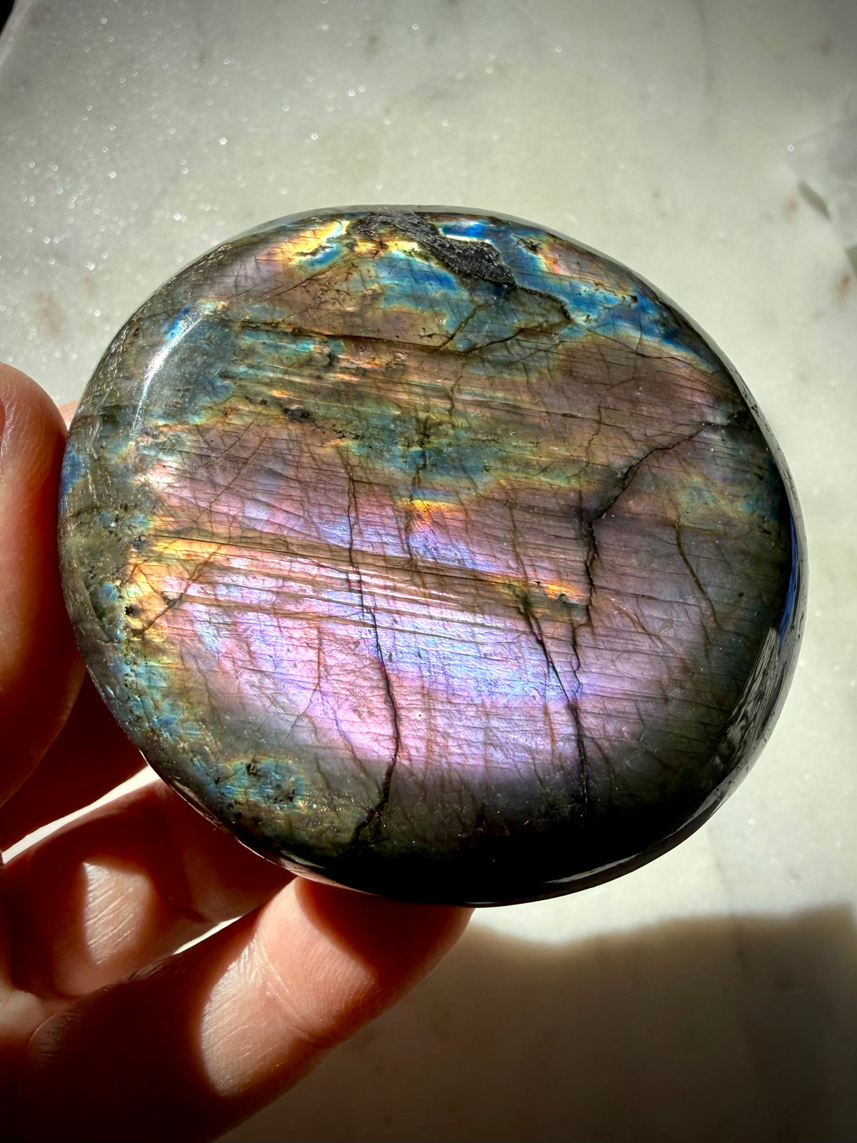 Purple flash Labradorite palm stone with lavender, pink and golden labradorescence, a one-of-a-kind Madagascar crystal