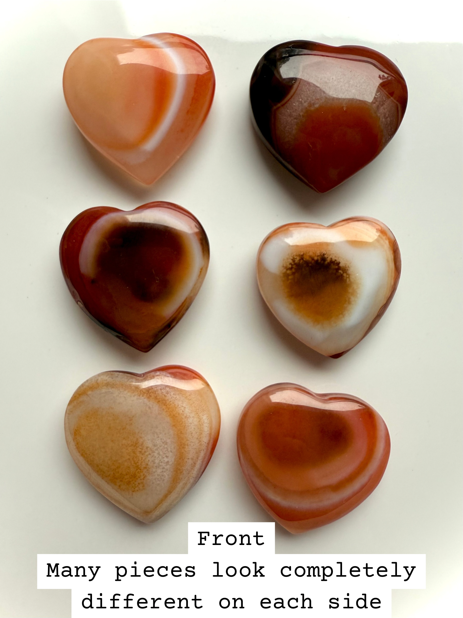 Front view of Mini Carnelian Heart crystal showing polished surface and vibrant orange color