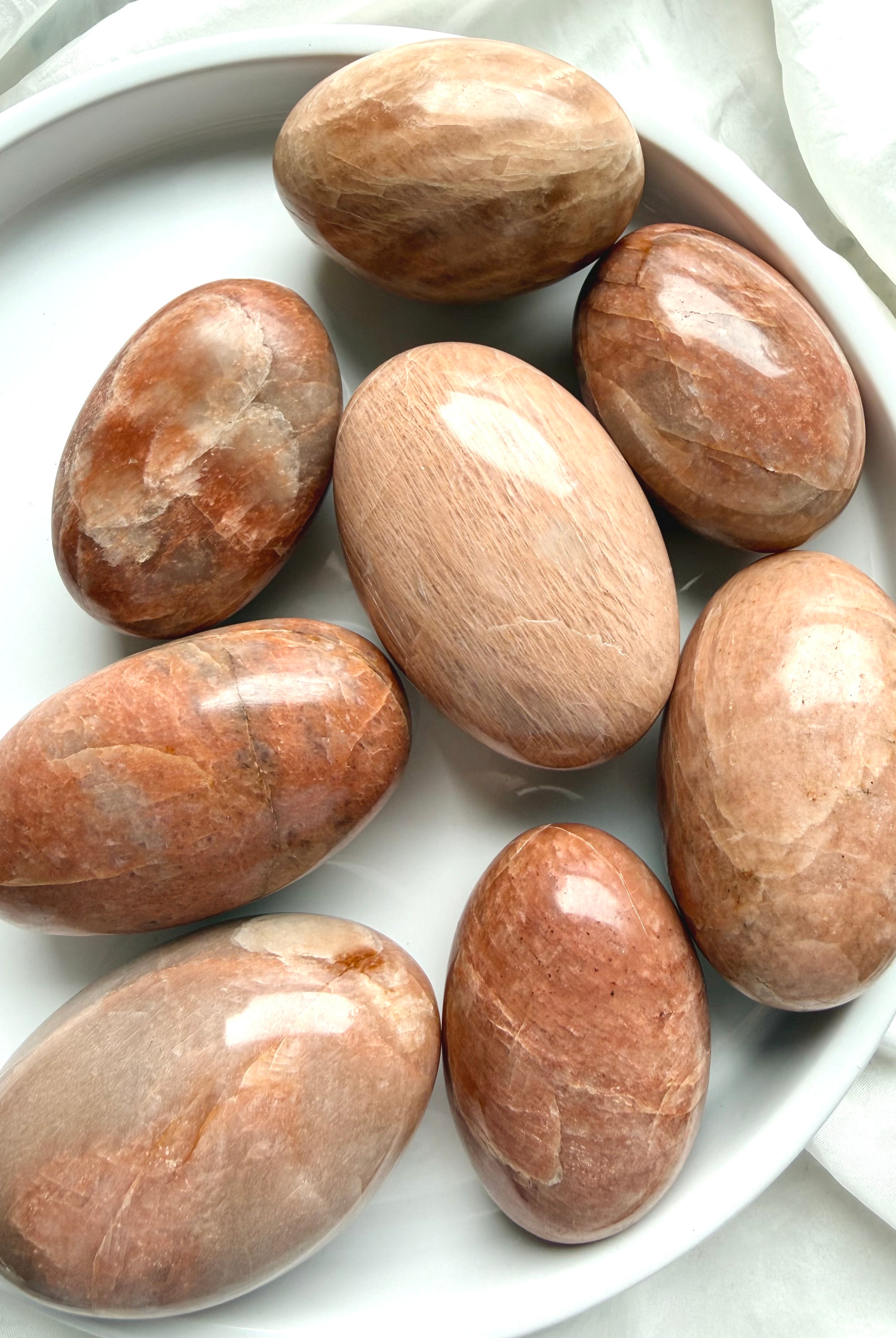Large Peach Moonstone palm stones with warm peach and apricot tones for emotional healing, intuition, and feminine energy