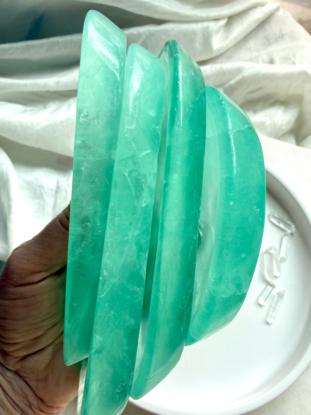 Polished Green Fluorite bowls with vibrant blue-green color and natural patterns
