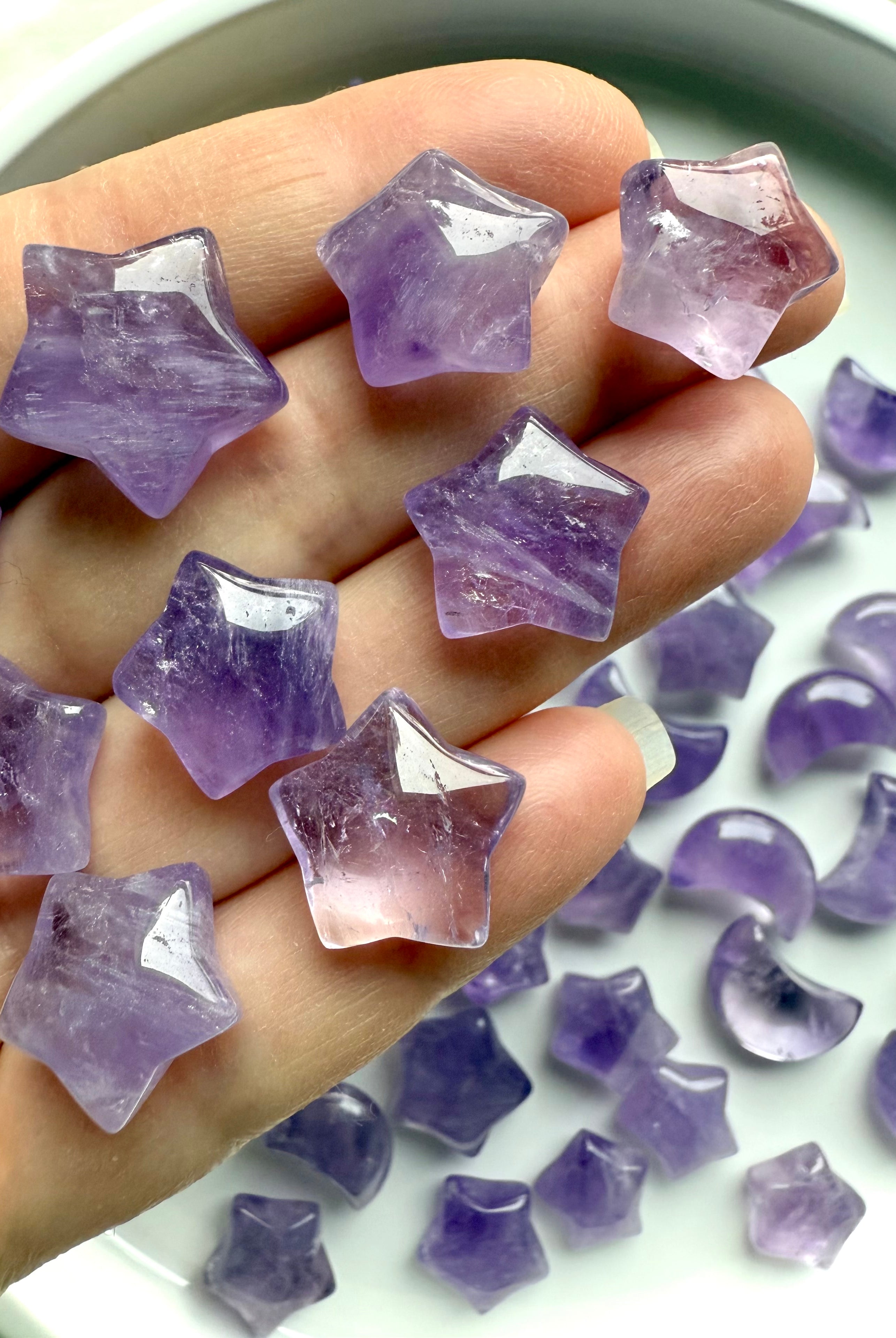 Mini Amethyst star crystals held in hand, calming Third Eye and Crown Chakra stones for peace and clarity