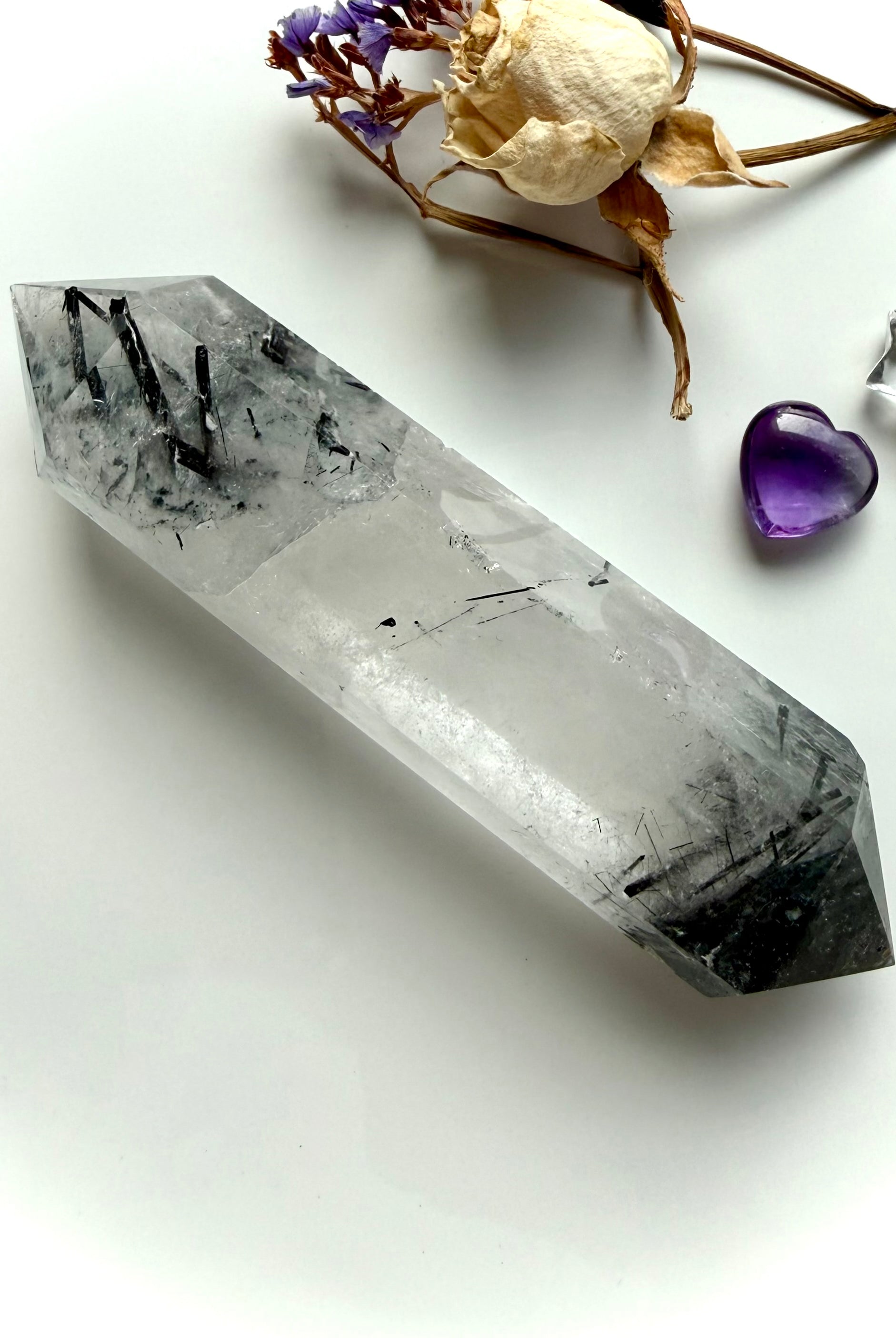 tourmalinated quartz double terminated crystal with inclusions concentrated at both ends