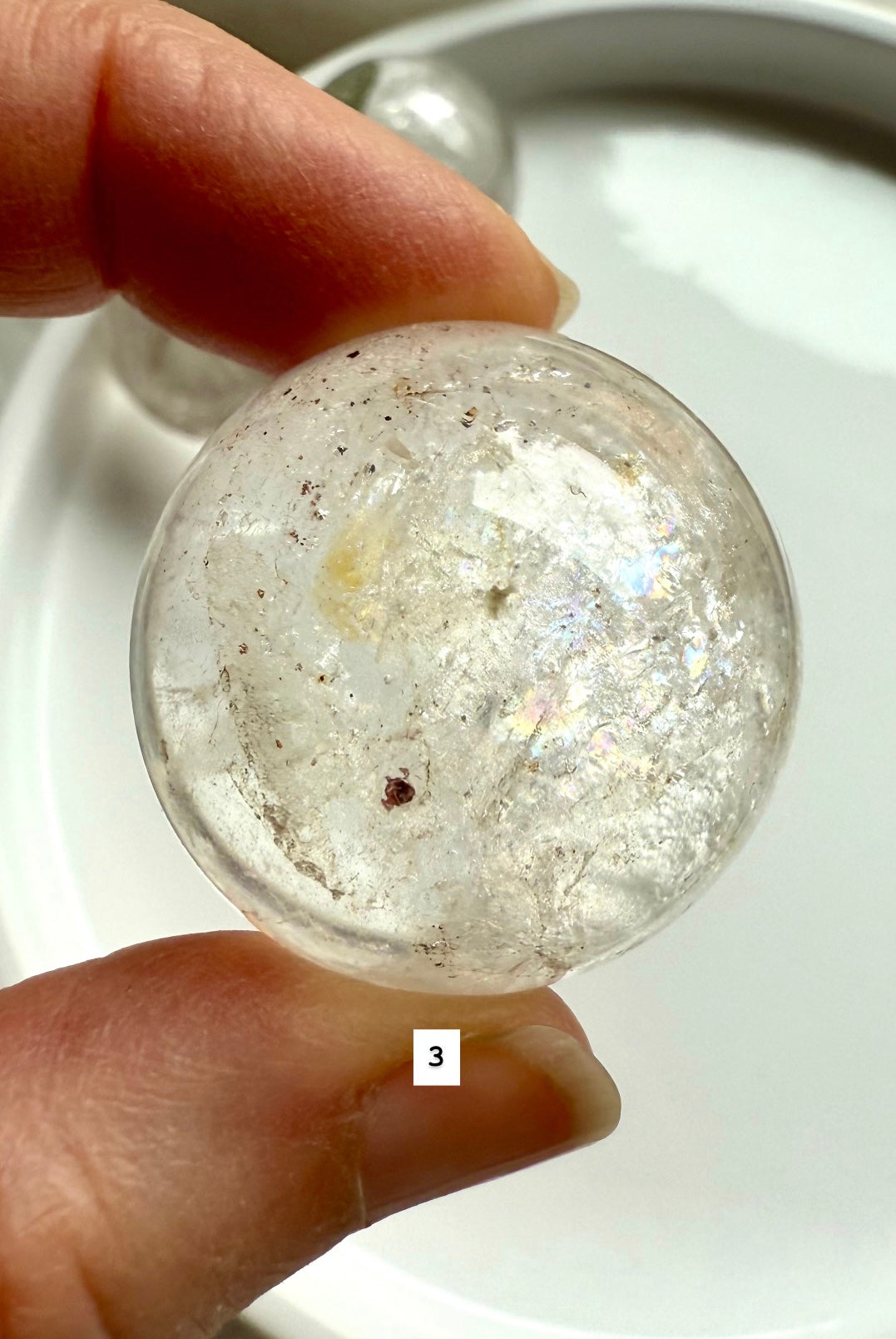 close up of a garden quartz sphere – mineral-filled lodolite for spiritual focus and grounding
