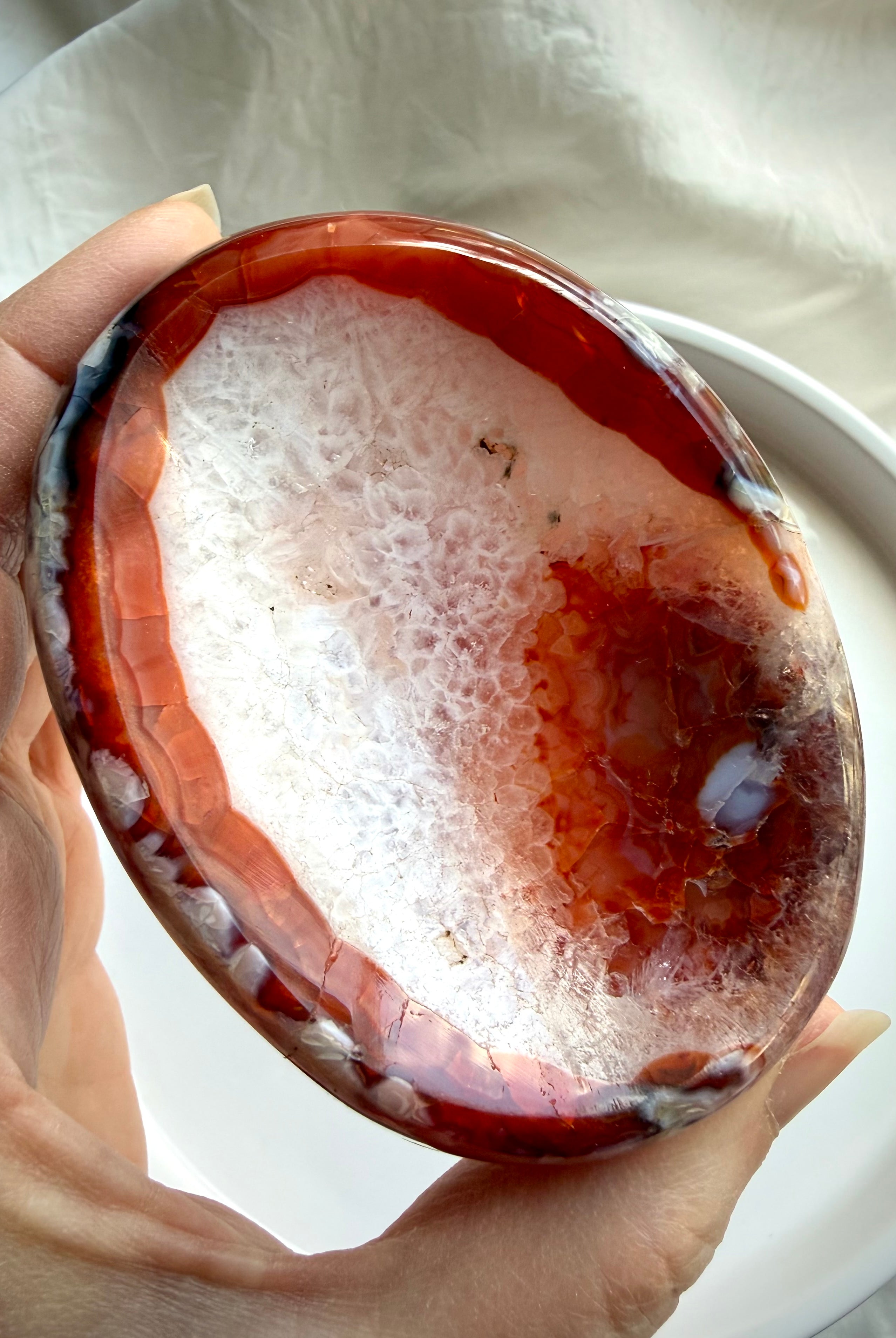 carnelian crystal bowl with white quartz center and agate banding polished gemstone dish for jewelry and altar use