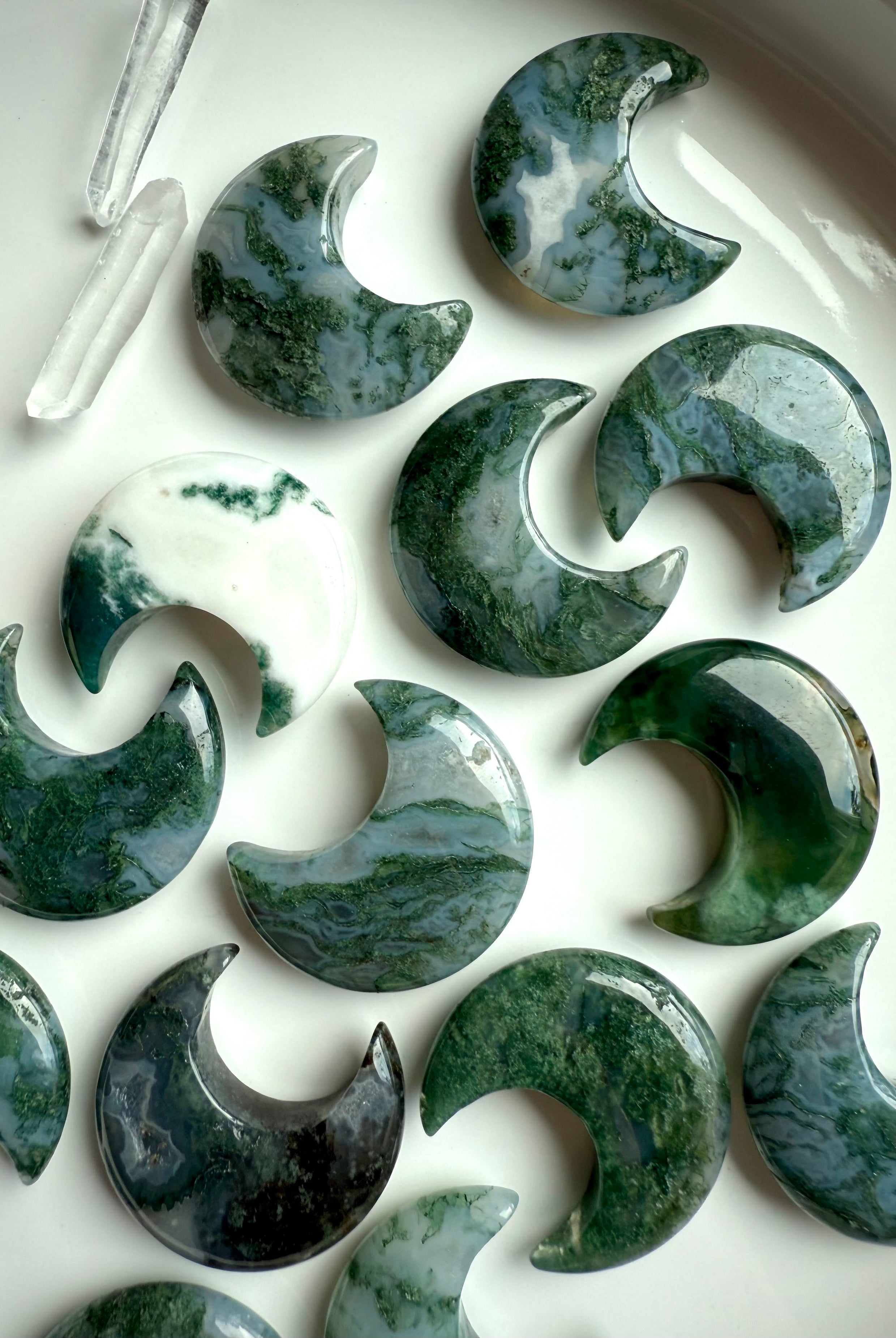 Moss Agate moon carvings in varied green tones with translucent chalcedony & earthy chlorite inclusions