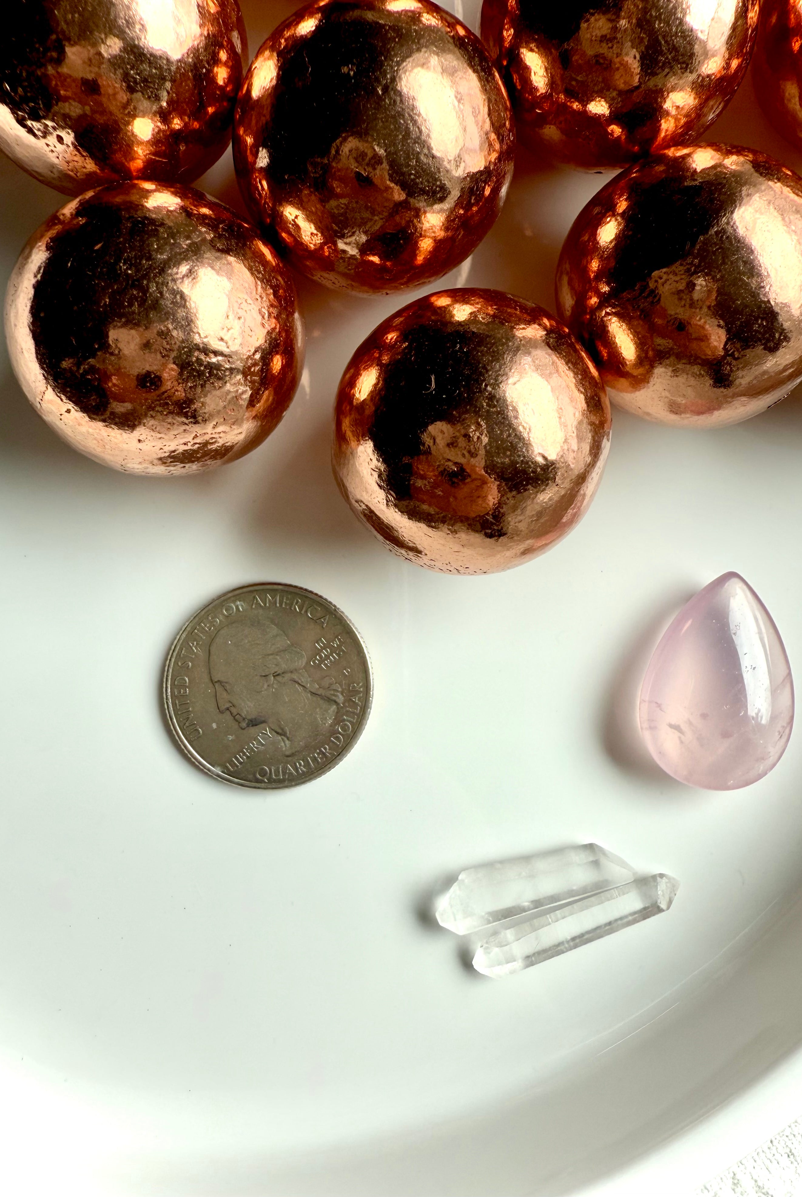 30 mm Michigan copper spheres shown with a quarter for scale