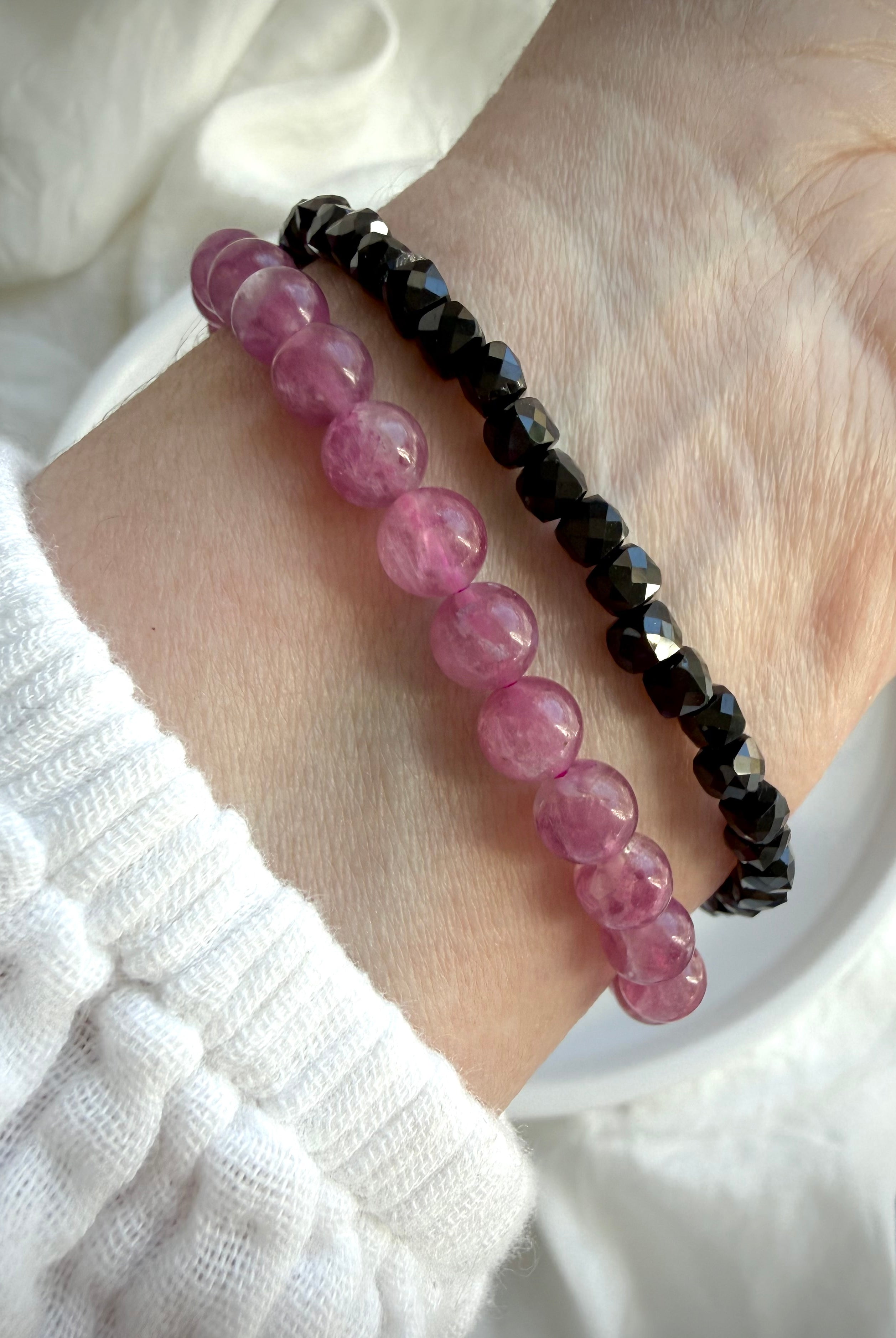 Pink Tourmaline bracelet paired with our faceted Black Spinel bracelet for a sophisticated pink and black gemstone stack