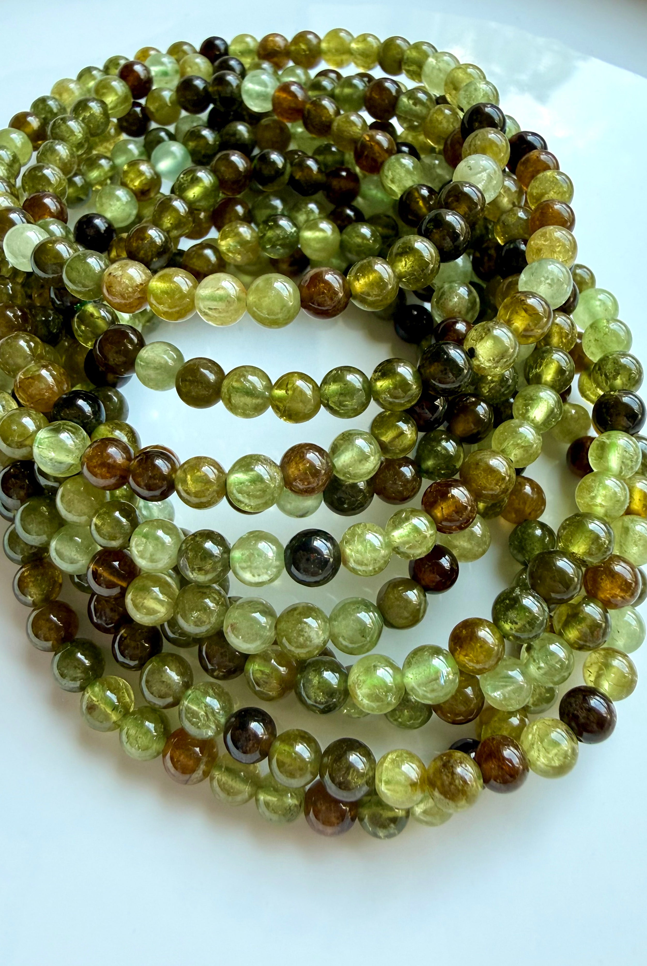 Premium green garnet bracelet stack with natural Tsavorite gemstones in chartreuse and amber hues