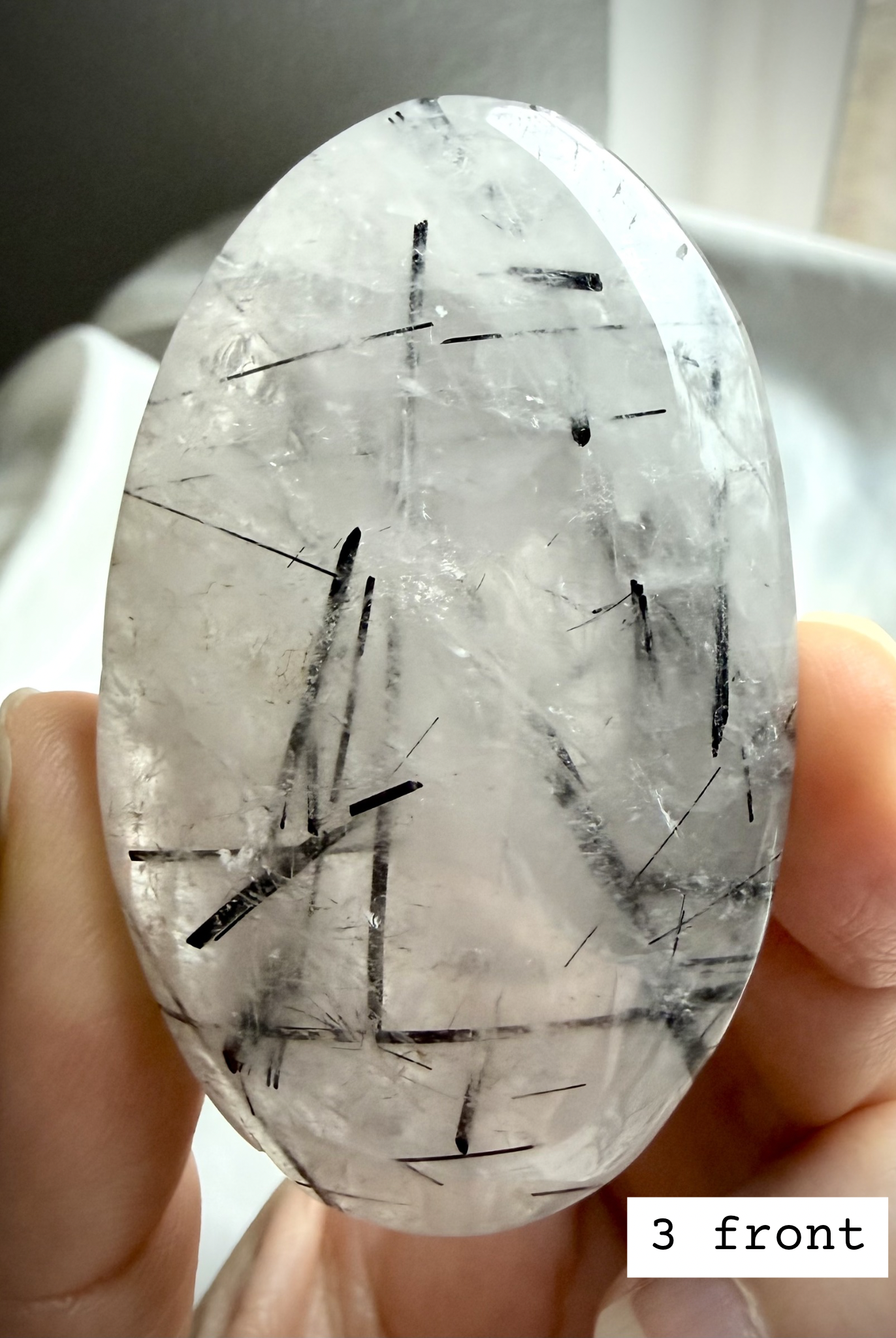 Black Tourmaline in Quartz palm stone 3 front view Tourmalinated Quartz protection stone